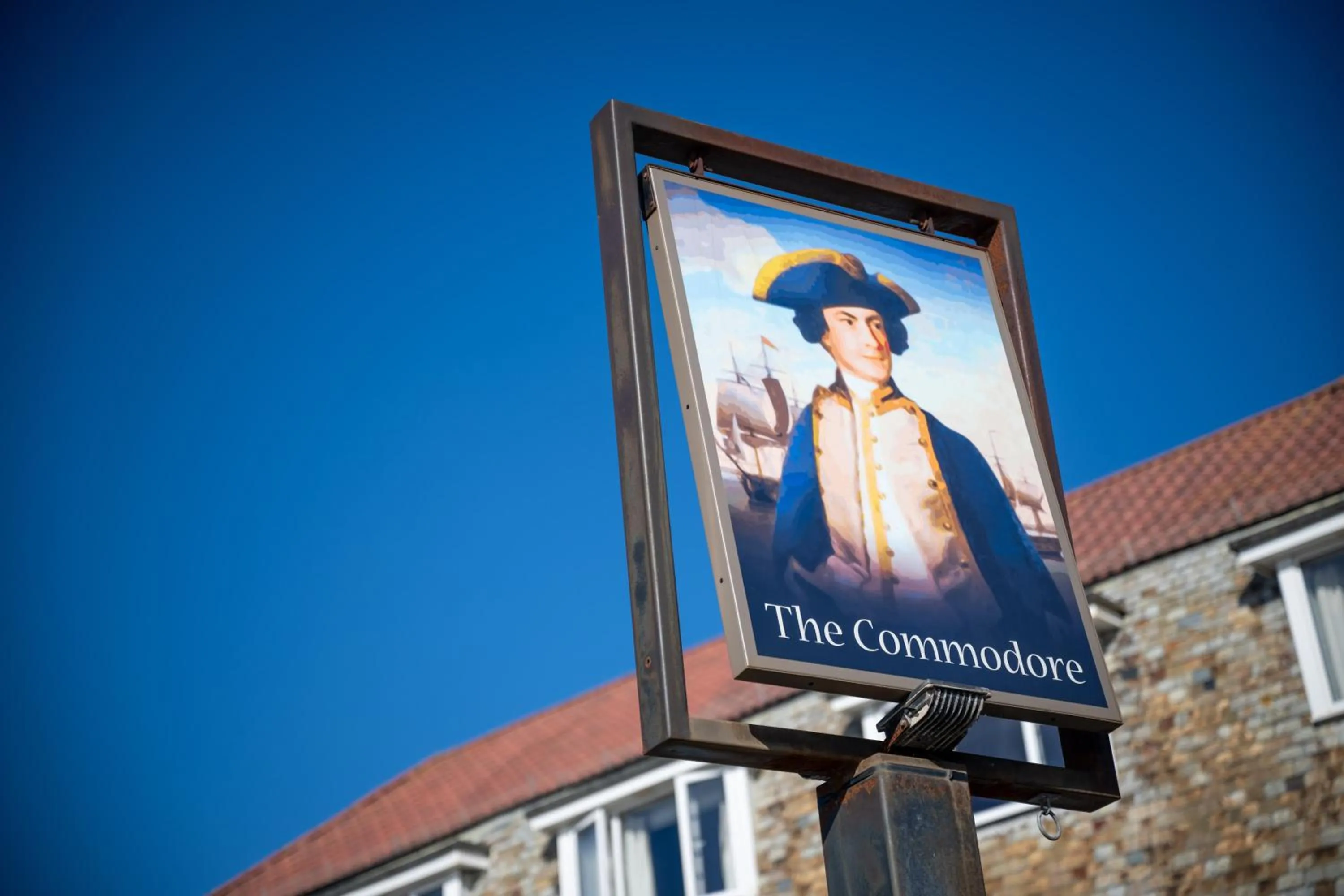 Property logo or sign in Commodore Hotel by Greene King Inns