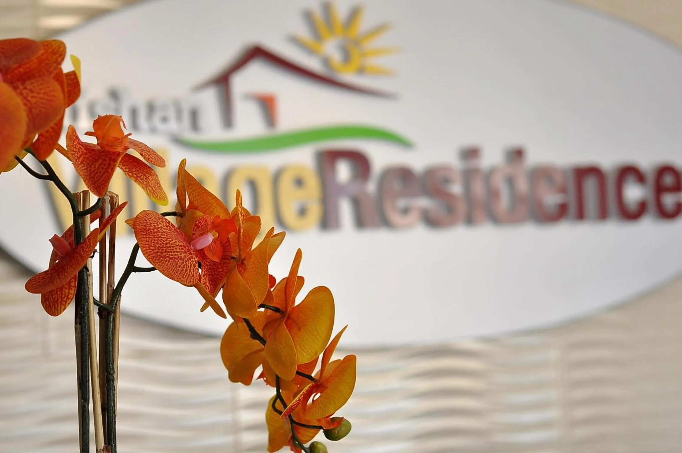 Property logo or sign in Rishan Village Residences