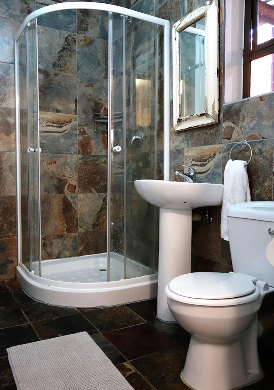 Bathroom in Veki's Village Cottages