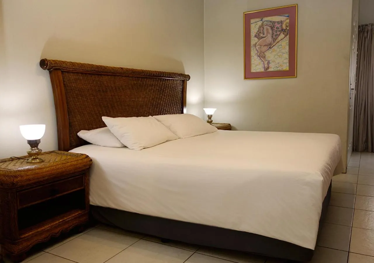 Bed in Veki's Village Cottages