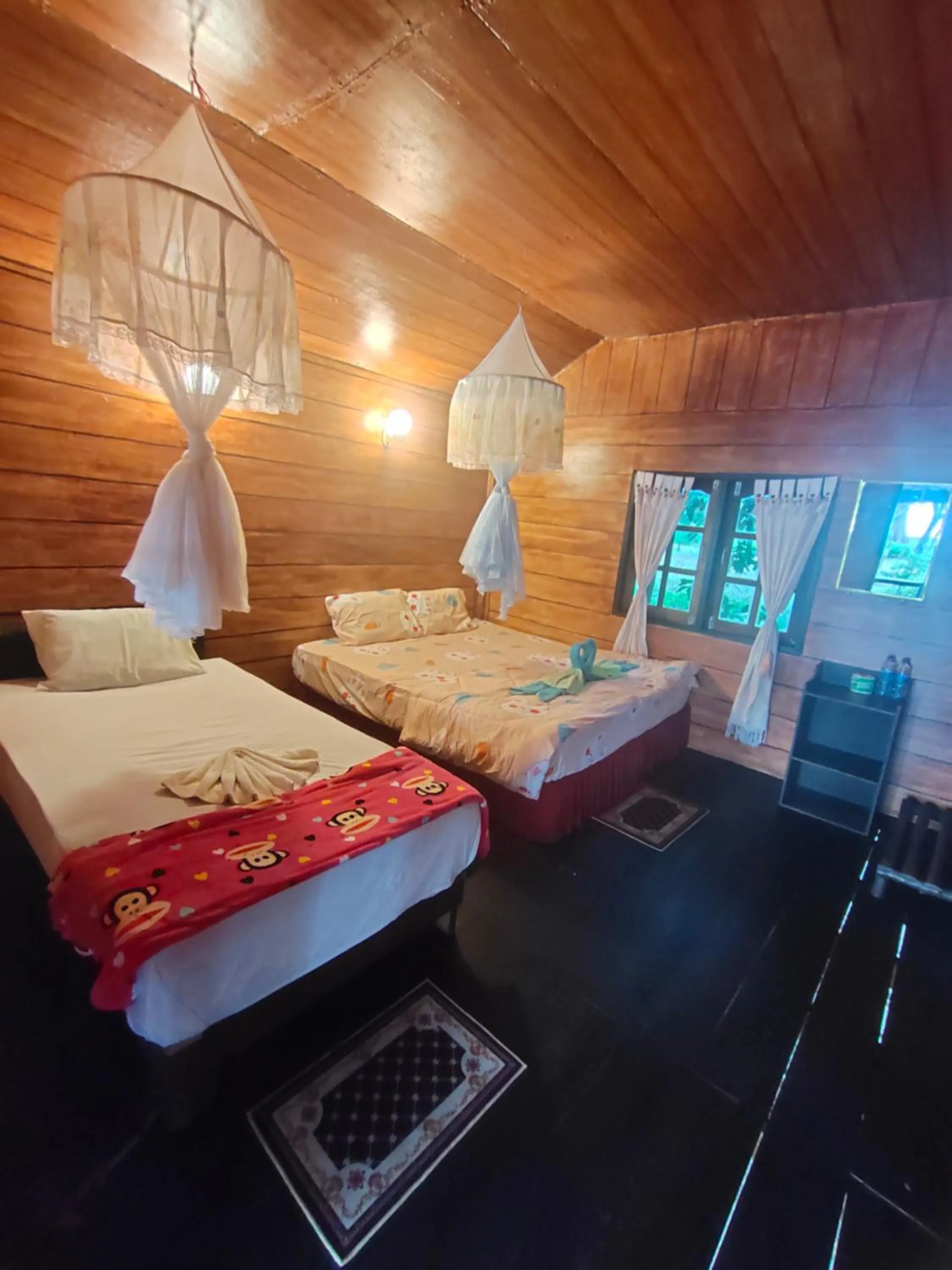 Bed in Phayam Coconut Beach Resort