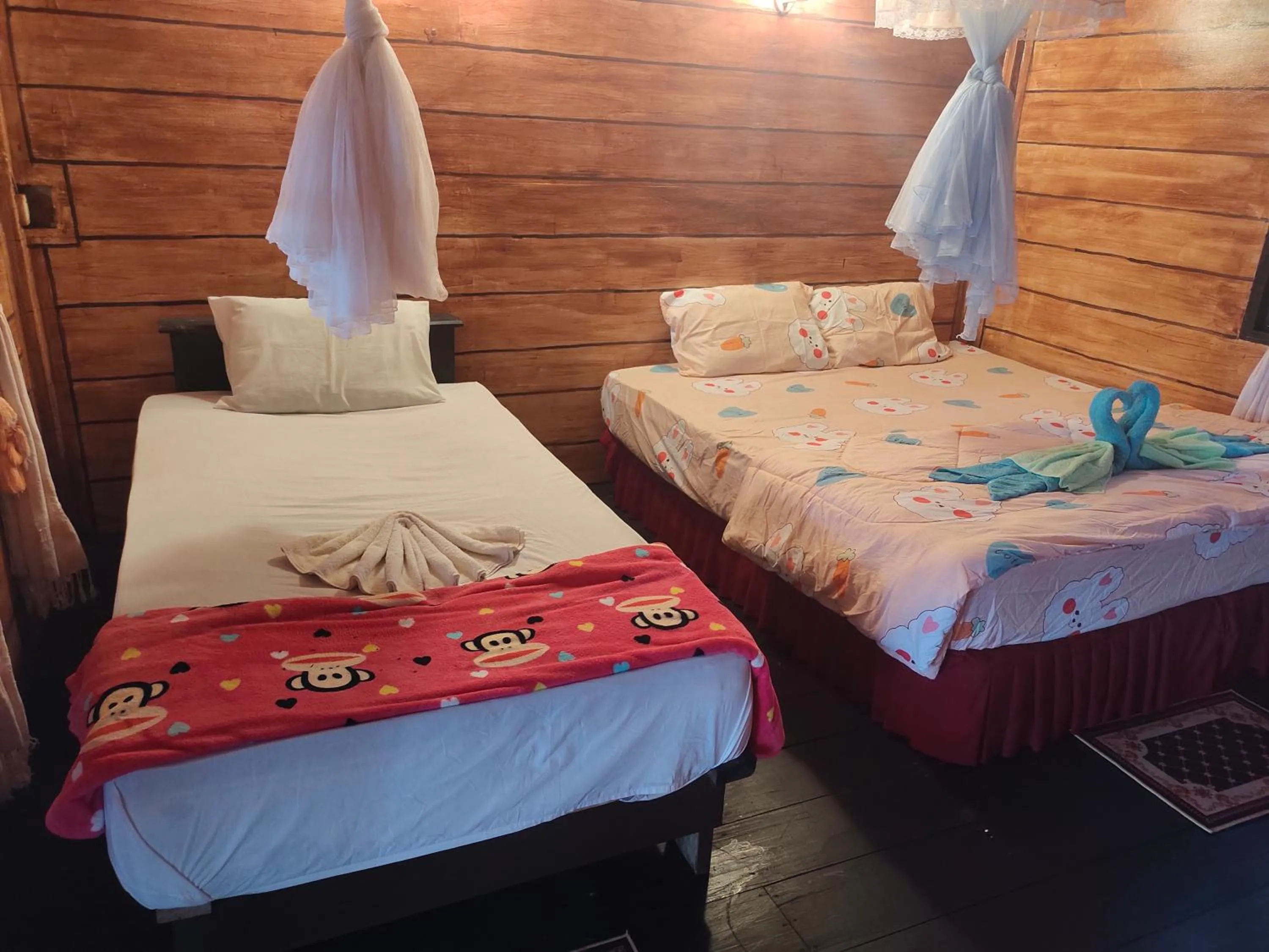 Bed in Phayam Coconut Beach Resort