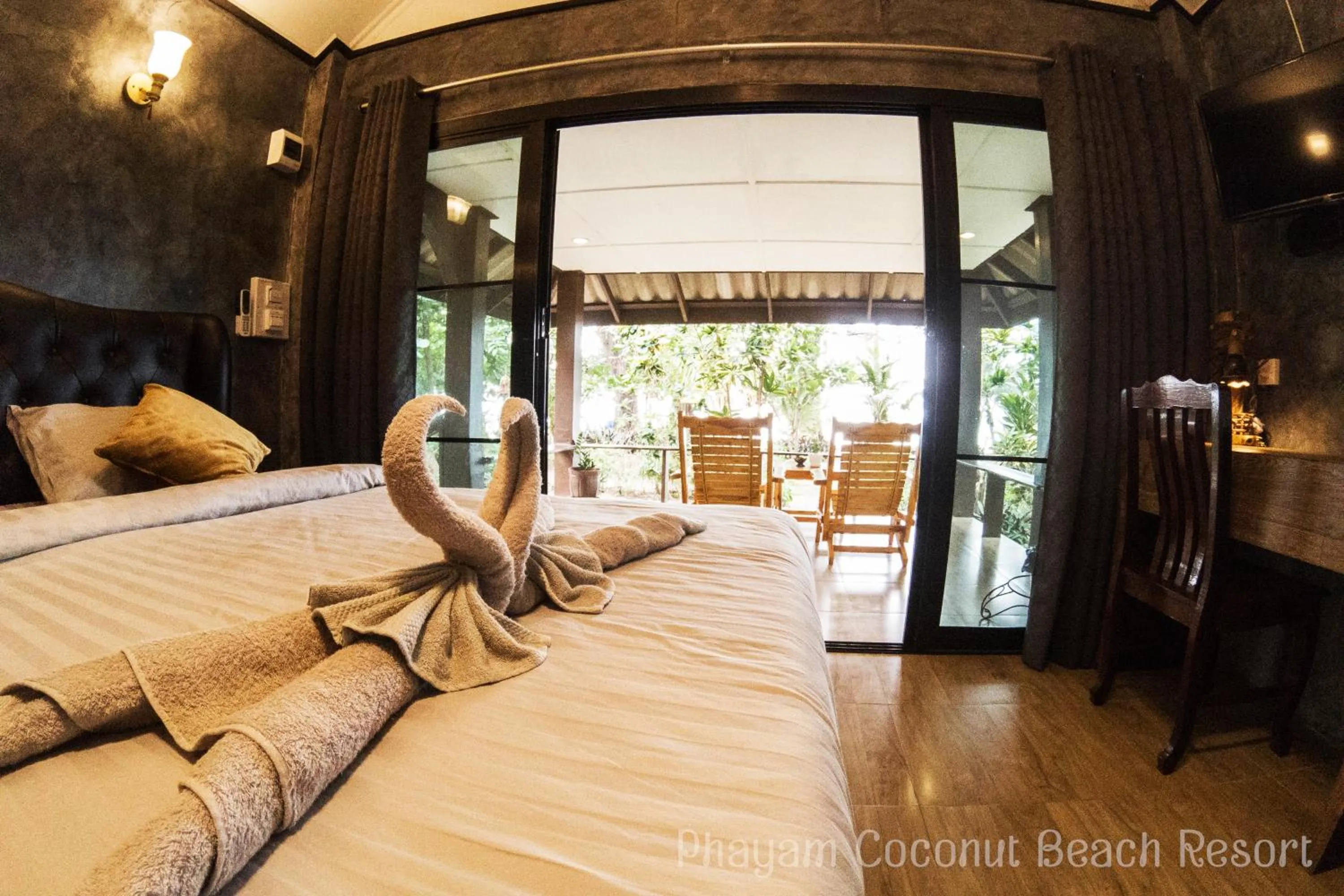 Bed in Phayam Coconut Beach Resort