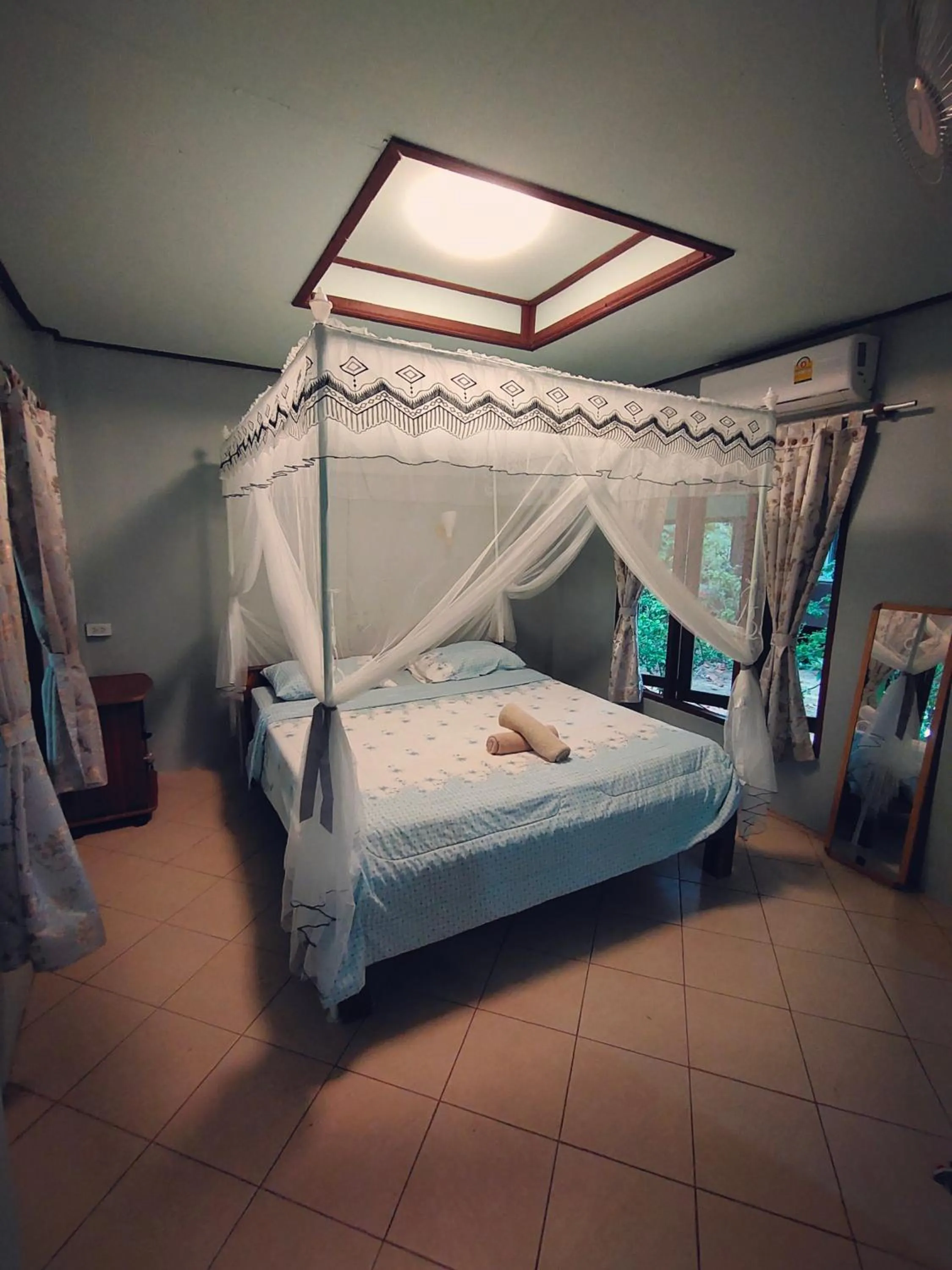 Bed in Phayam Coconut Beach Resort