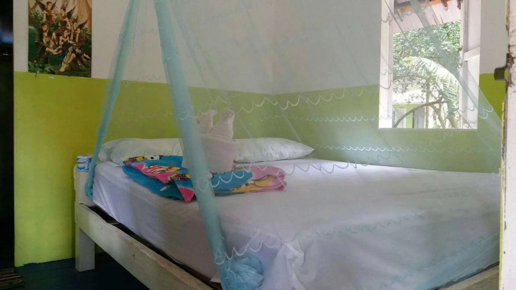 Bed in Phayam Coconut Beach Resort