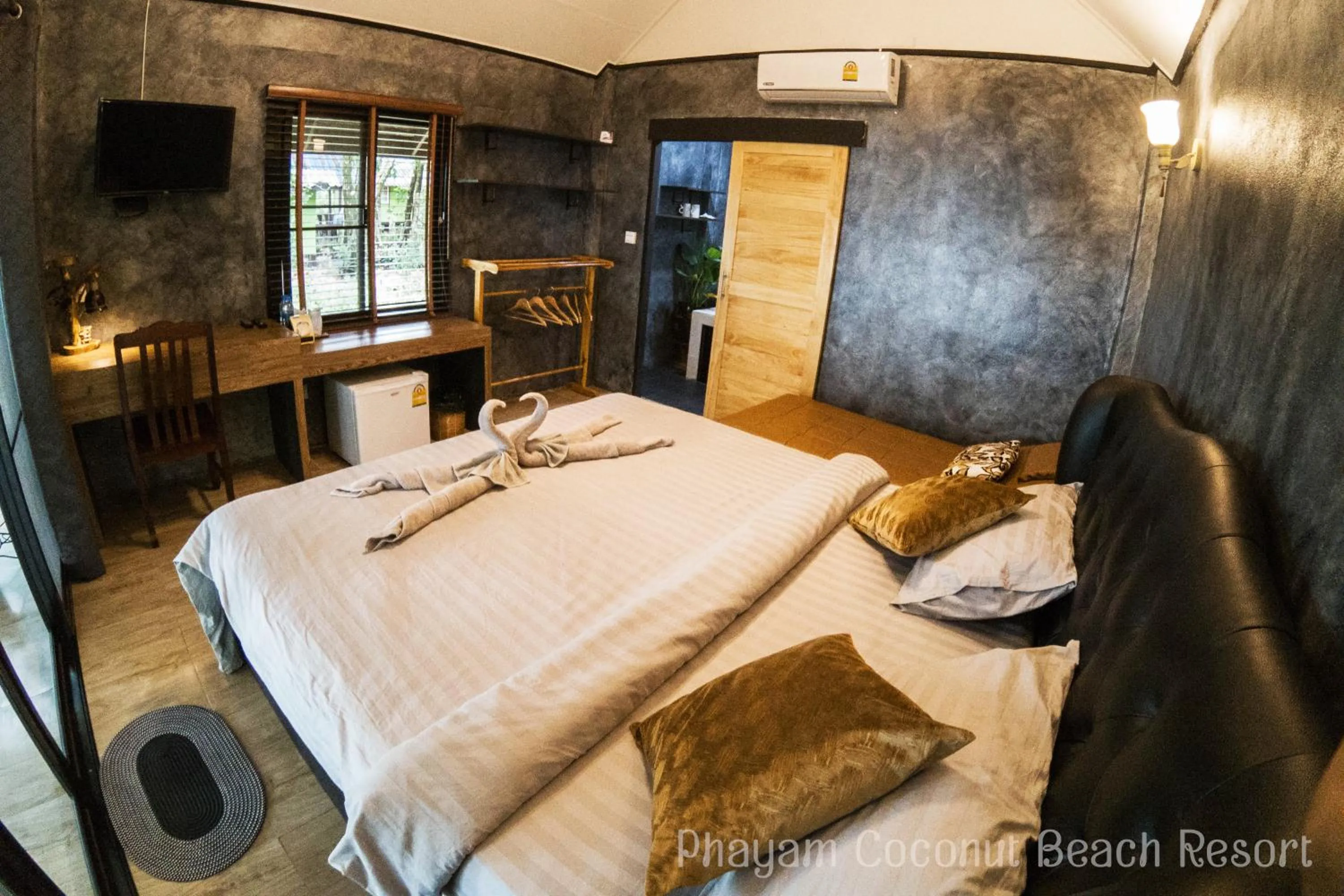 Bed in Phayam Coconut Beach Resort