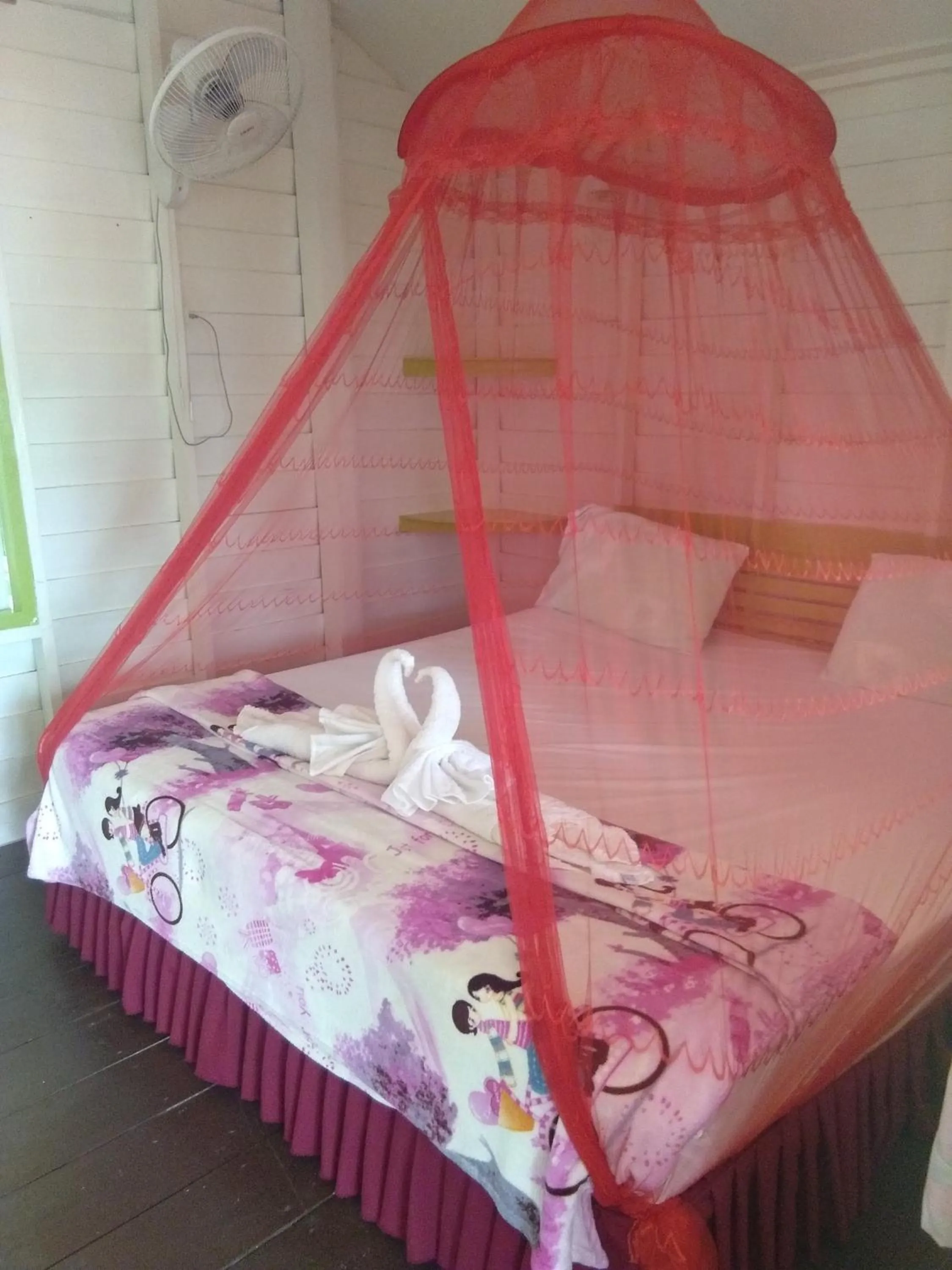 Bed in Phayam Coconut Beach Resort