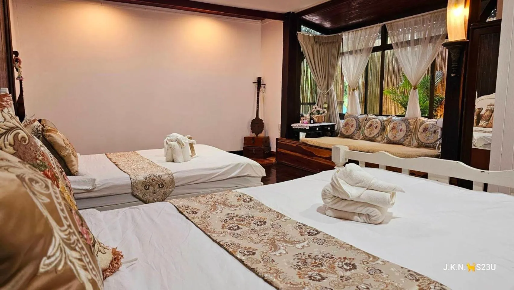 Bed in The Antique Riverside Resort