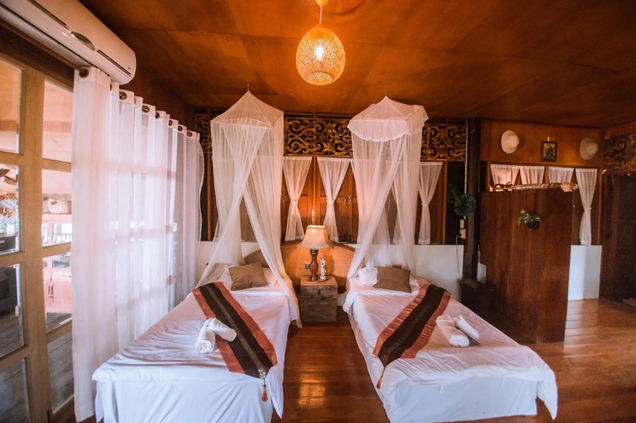 Bed in The Antique Riverside Resort