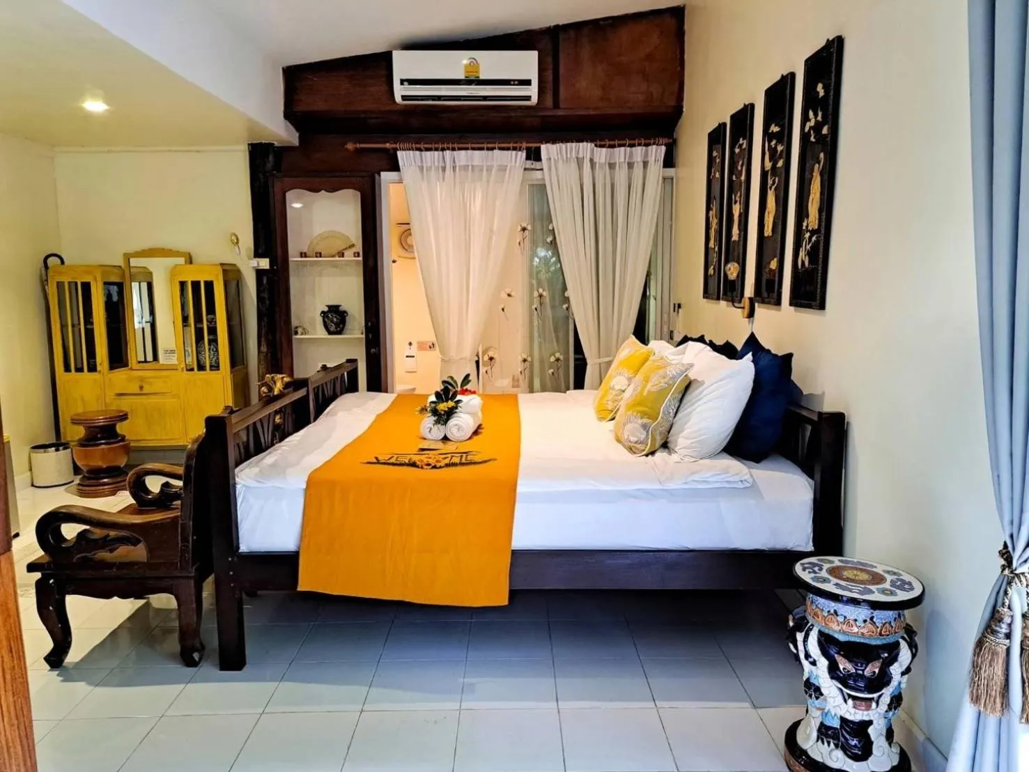 Bed in The Antique Riverside Resort