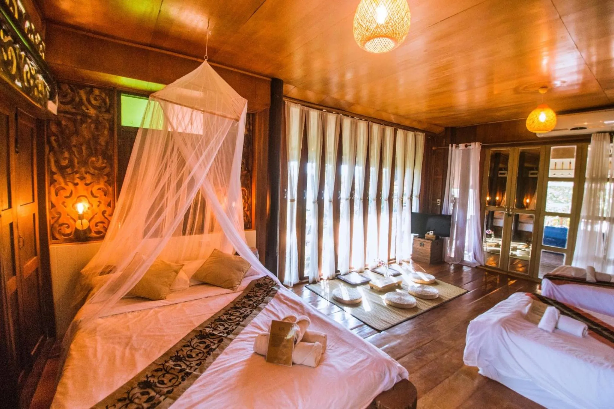 Bed in The Antique Riverside Resort