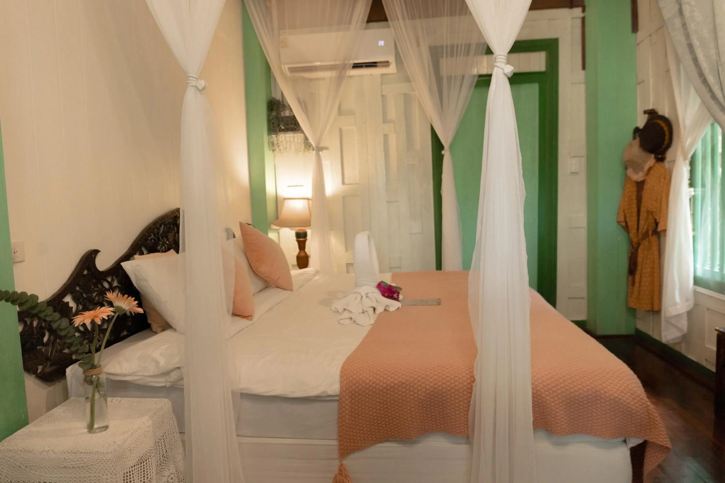 Bed in The Antique Riverside Resort