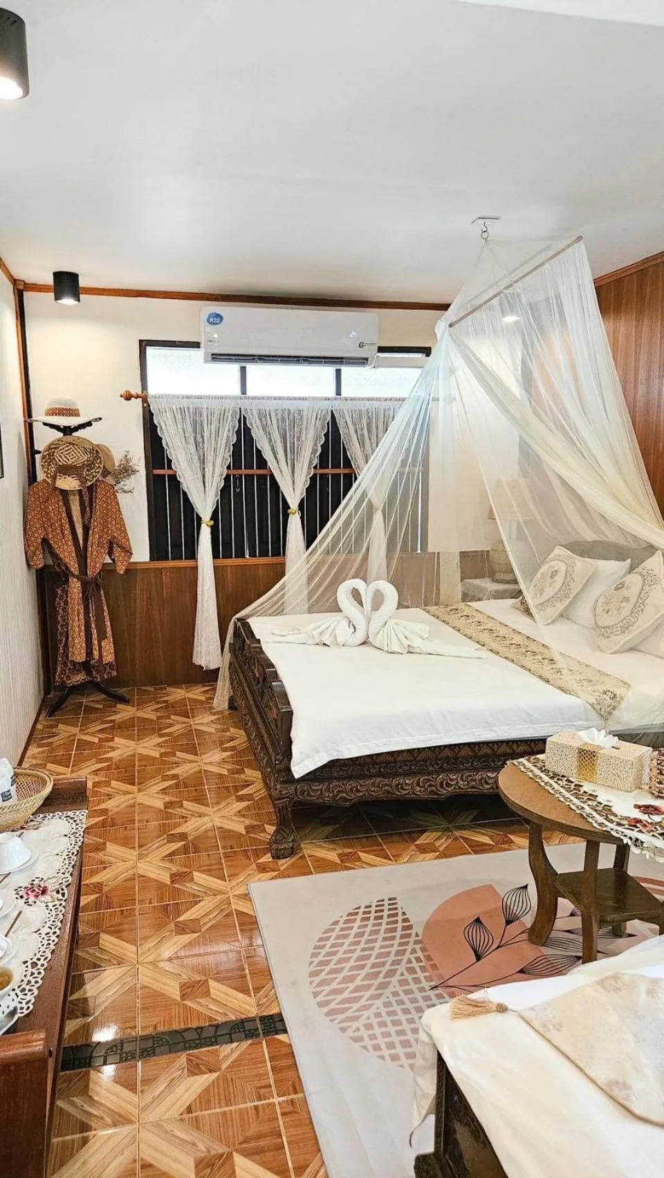 Bed in The Antique Riverside Resort