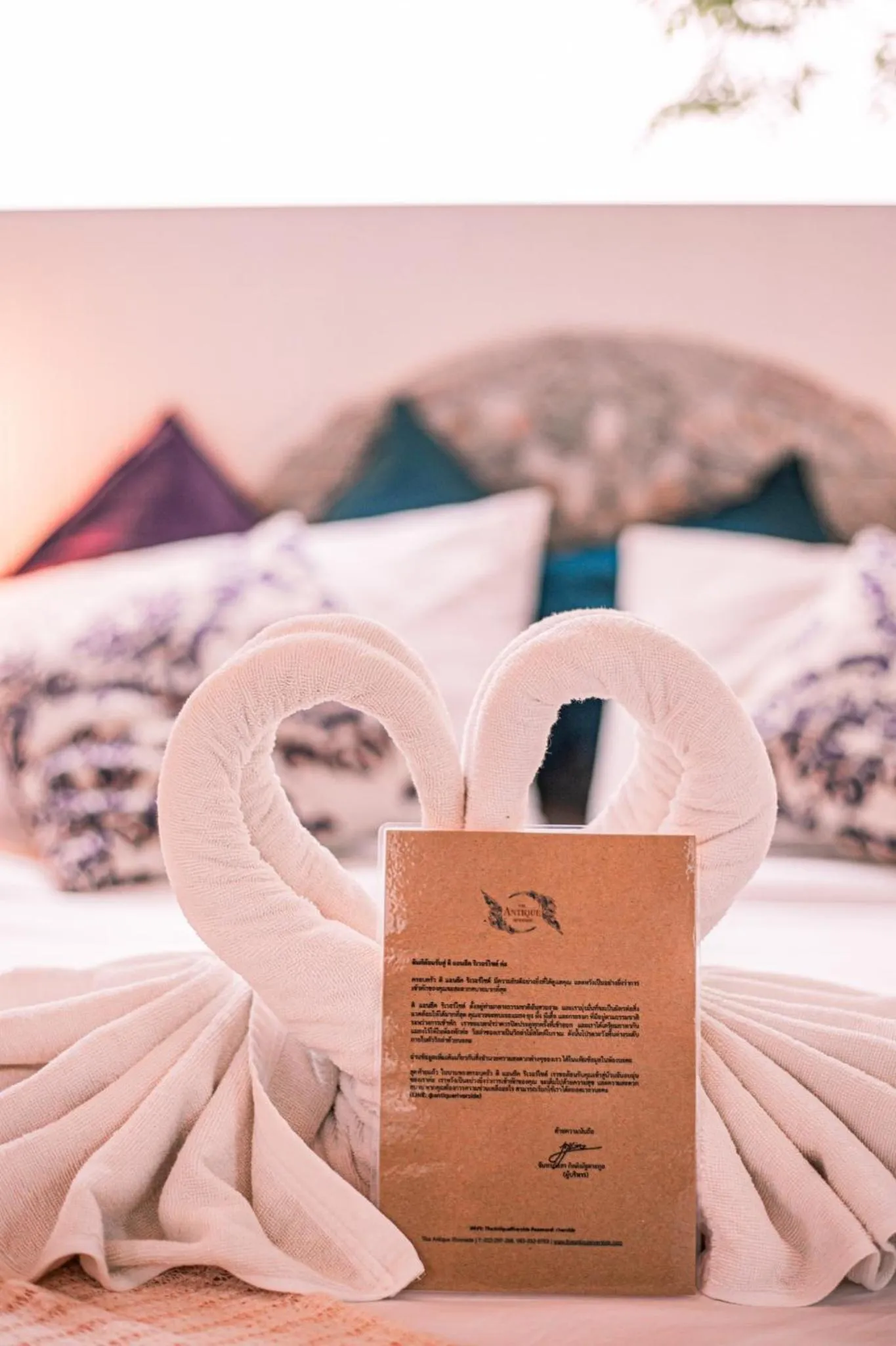 Bed in The Antique Riverside Resort