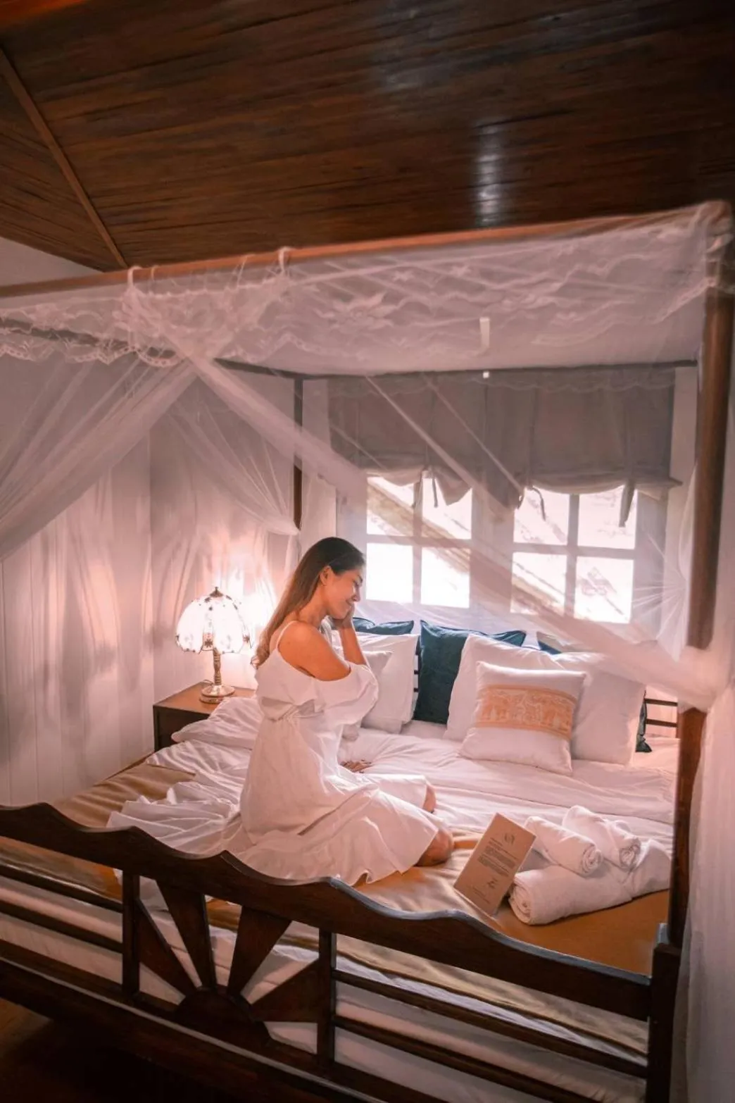 Bed in The Antique Riverside Resort