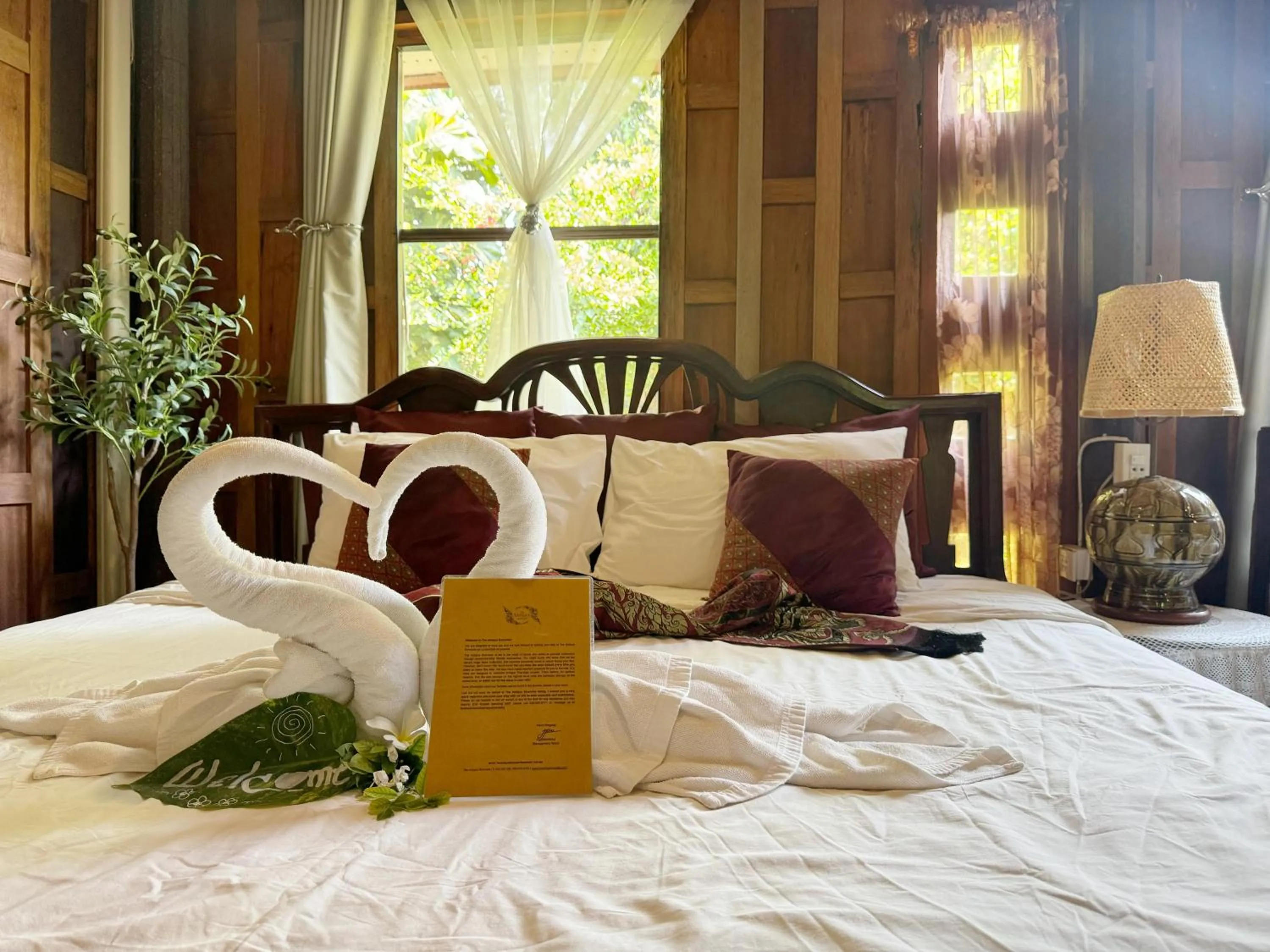 Bed in The Antique Riverside Resort