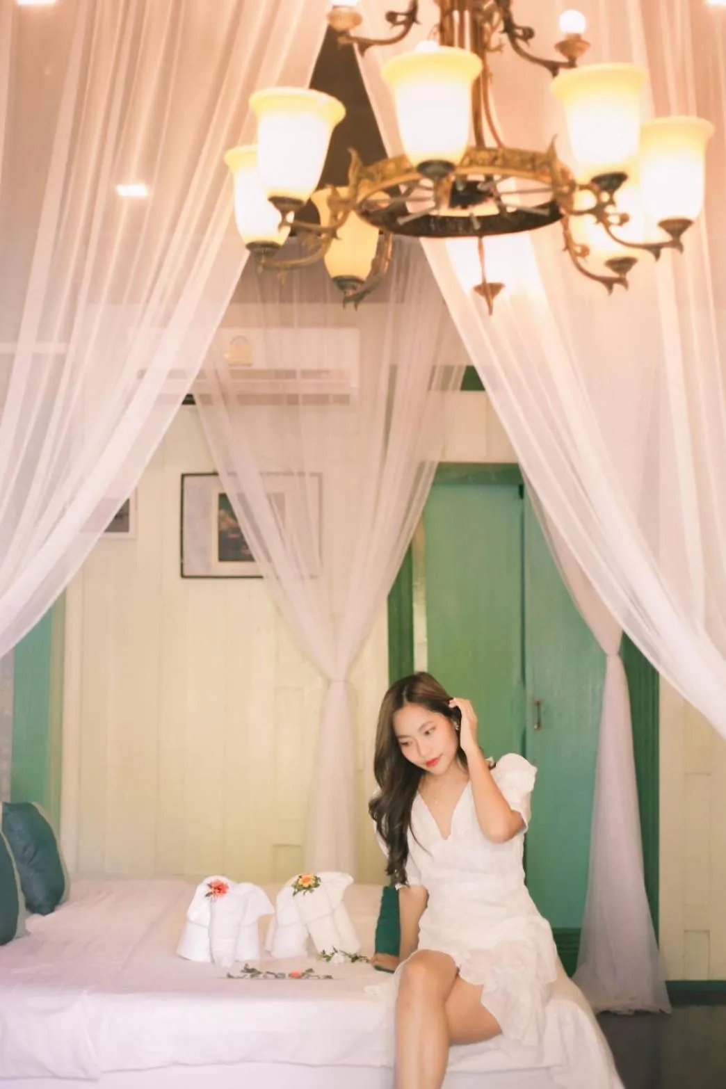 Bed in The Antique Riverside Resort