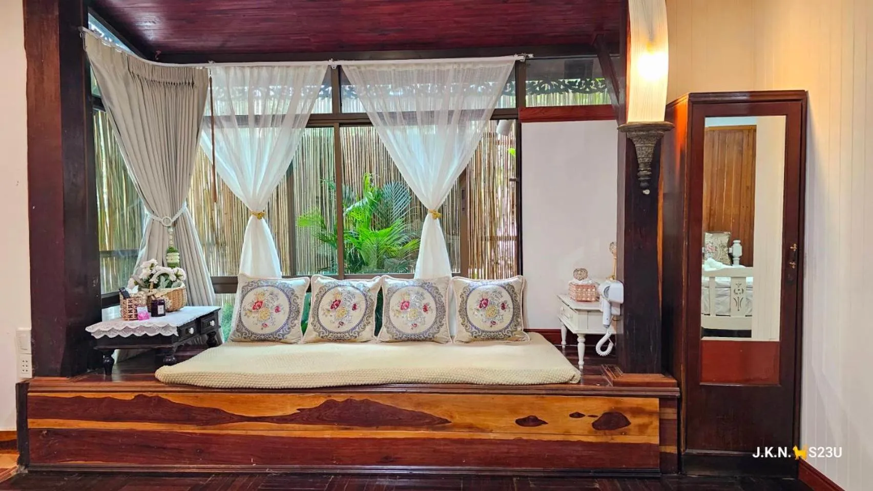 Bed in The Antique Riverside Resort