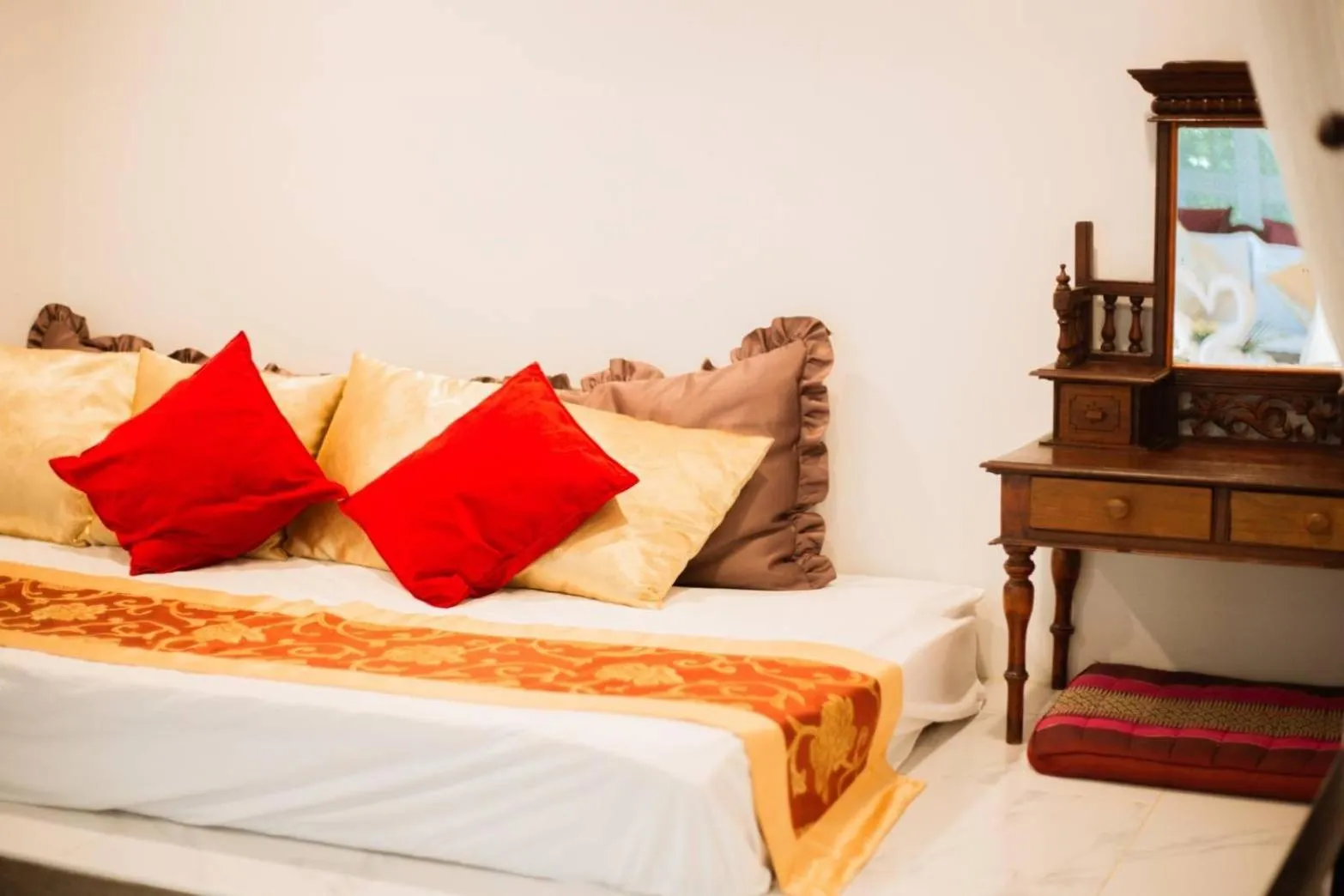 Bed in The Antique Riverside Resort