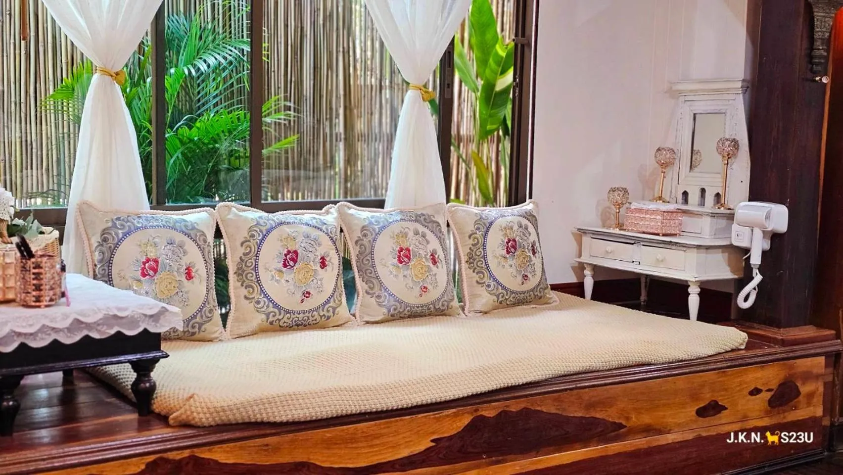 Bed in The Antique Riverside Resort