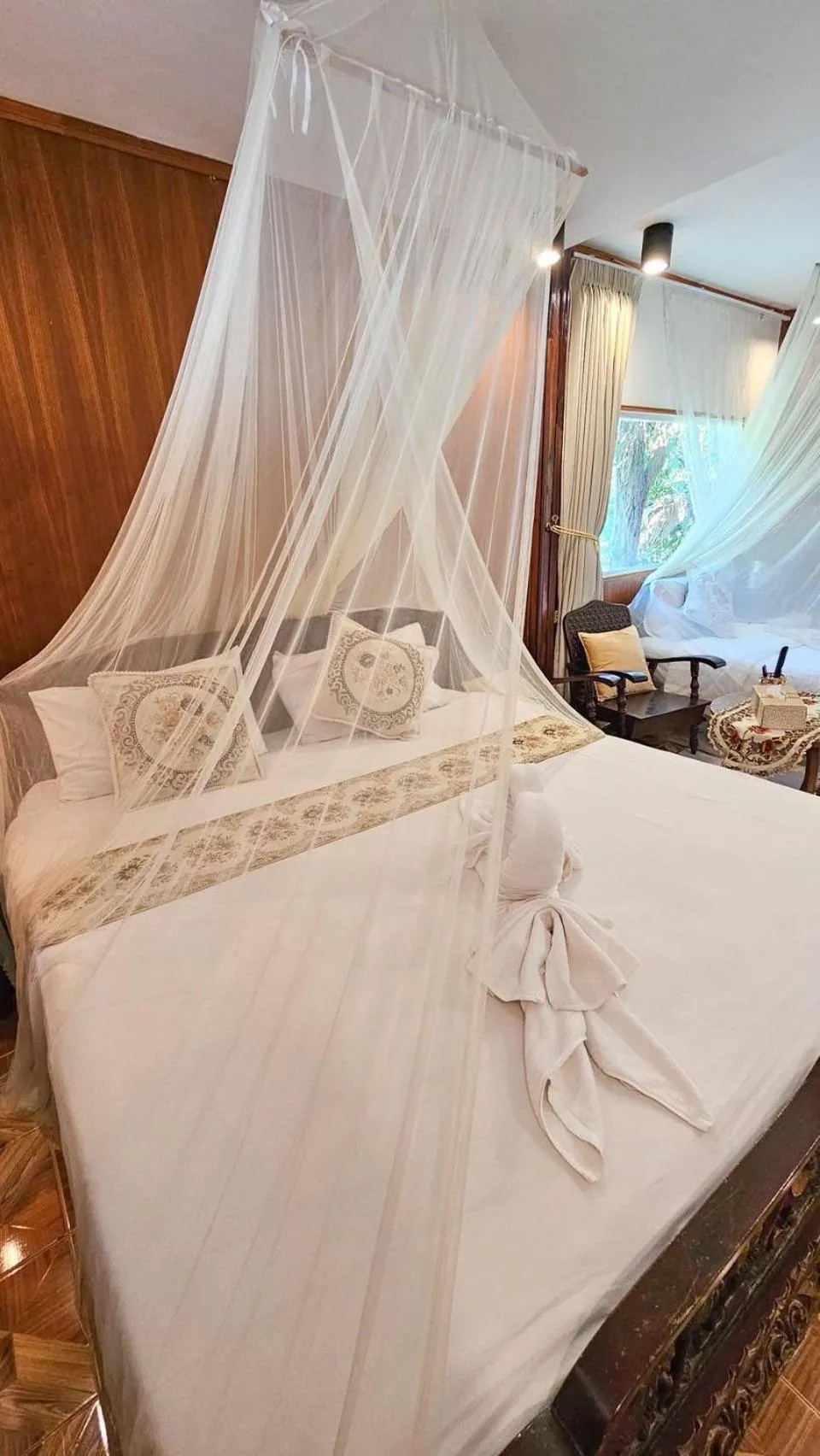 Bed in The Antique Riverside Resort