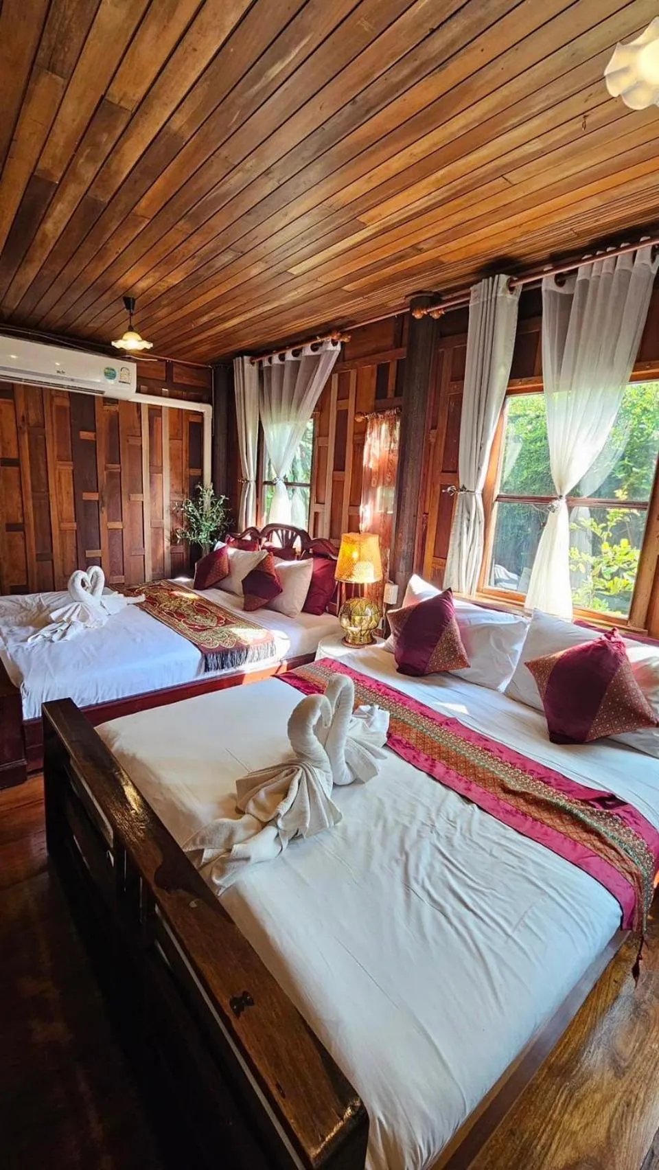 Bed in The Antique Riverside Resort