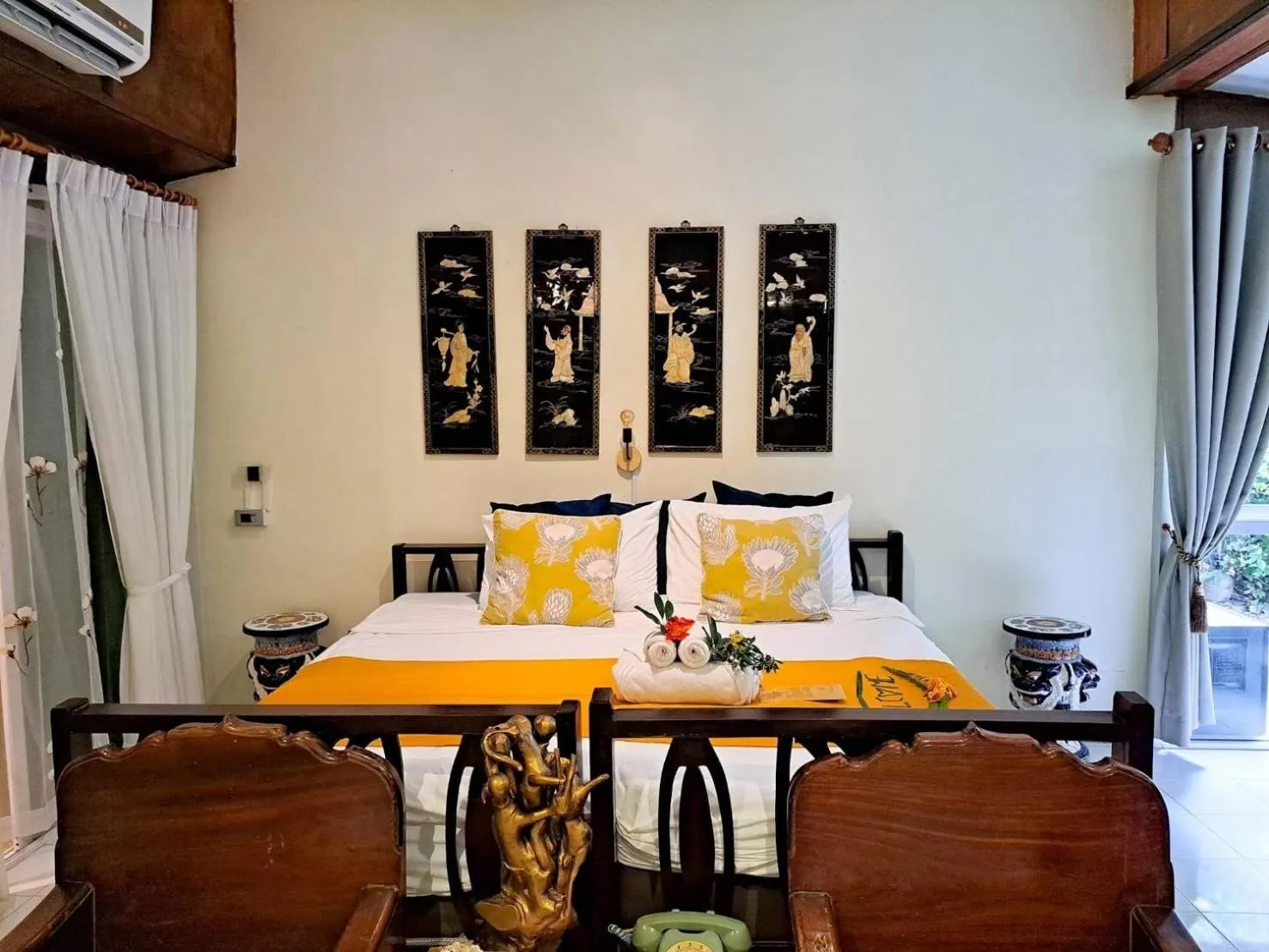 Bed in The Antique Riverside Resort