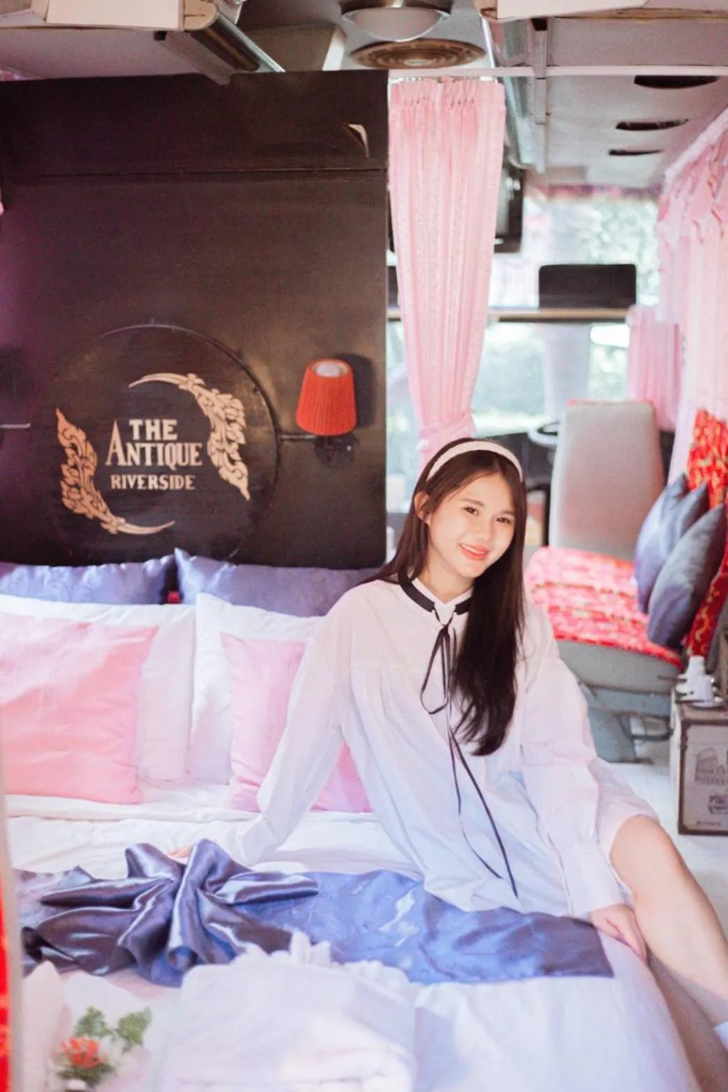 Bed in The Antique Riverside Resort