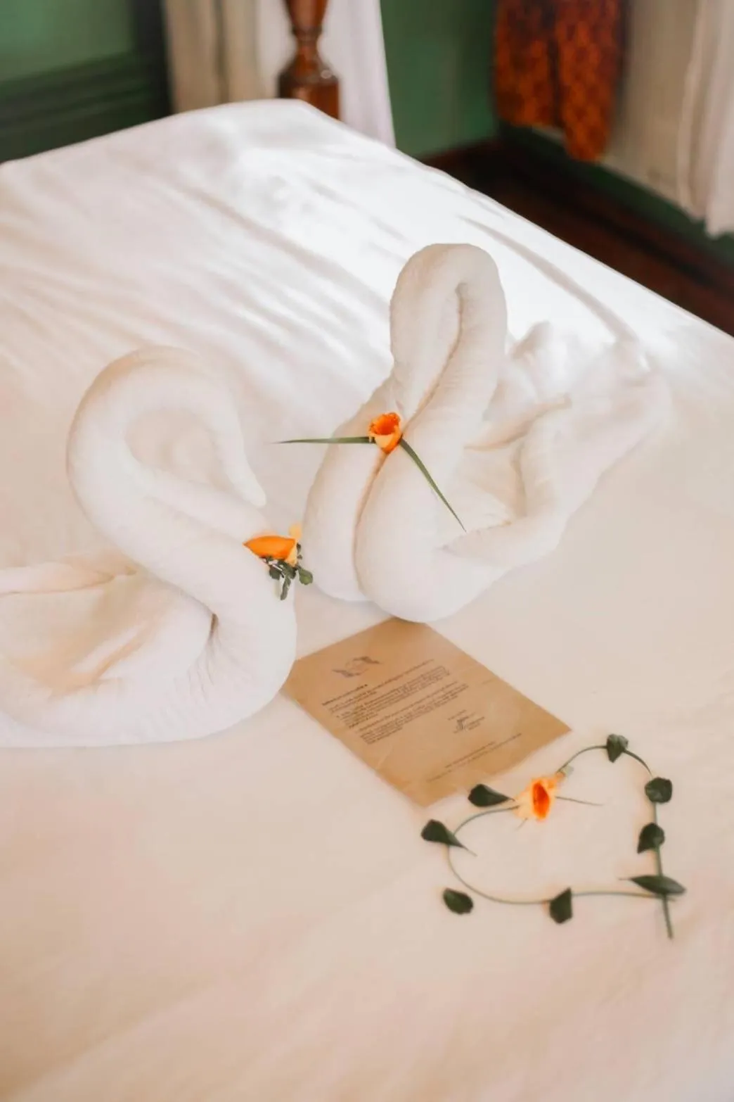 Bed in The Antique Riverside Resort