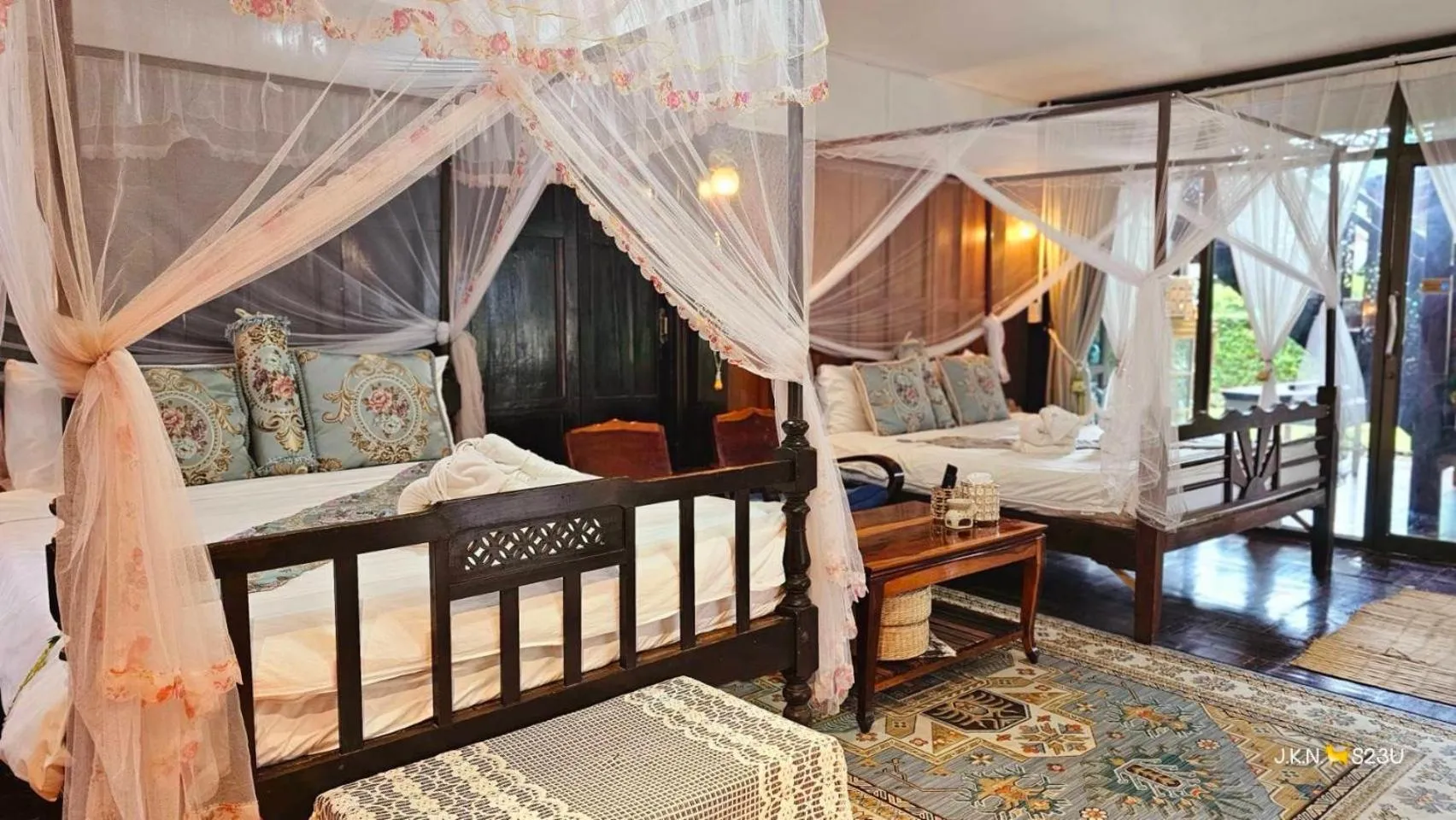 Bed in The Antique Riverside Resort