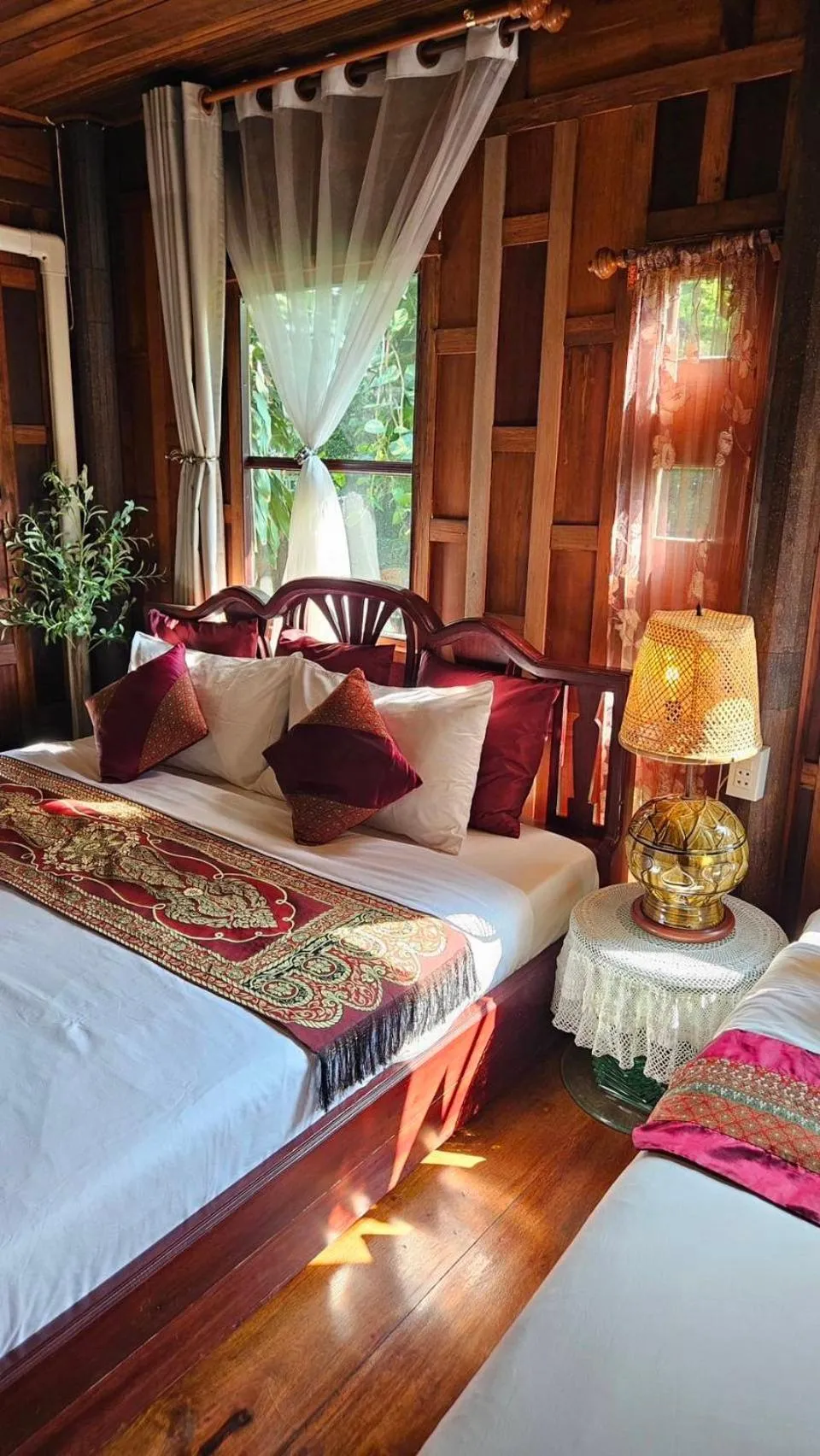 Bed in The Antique Riverside Resort