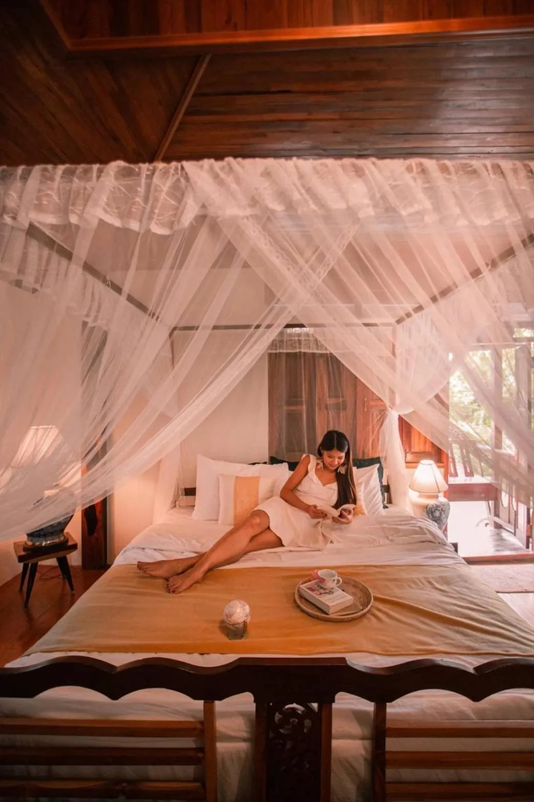 Bed in The Antique Riverside Resort