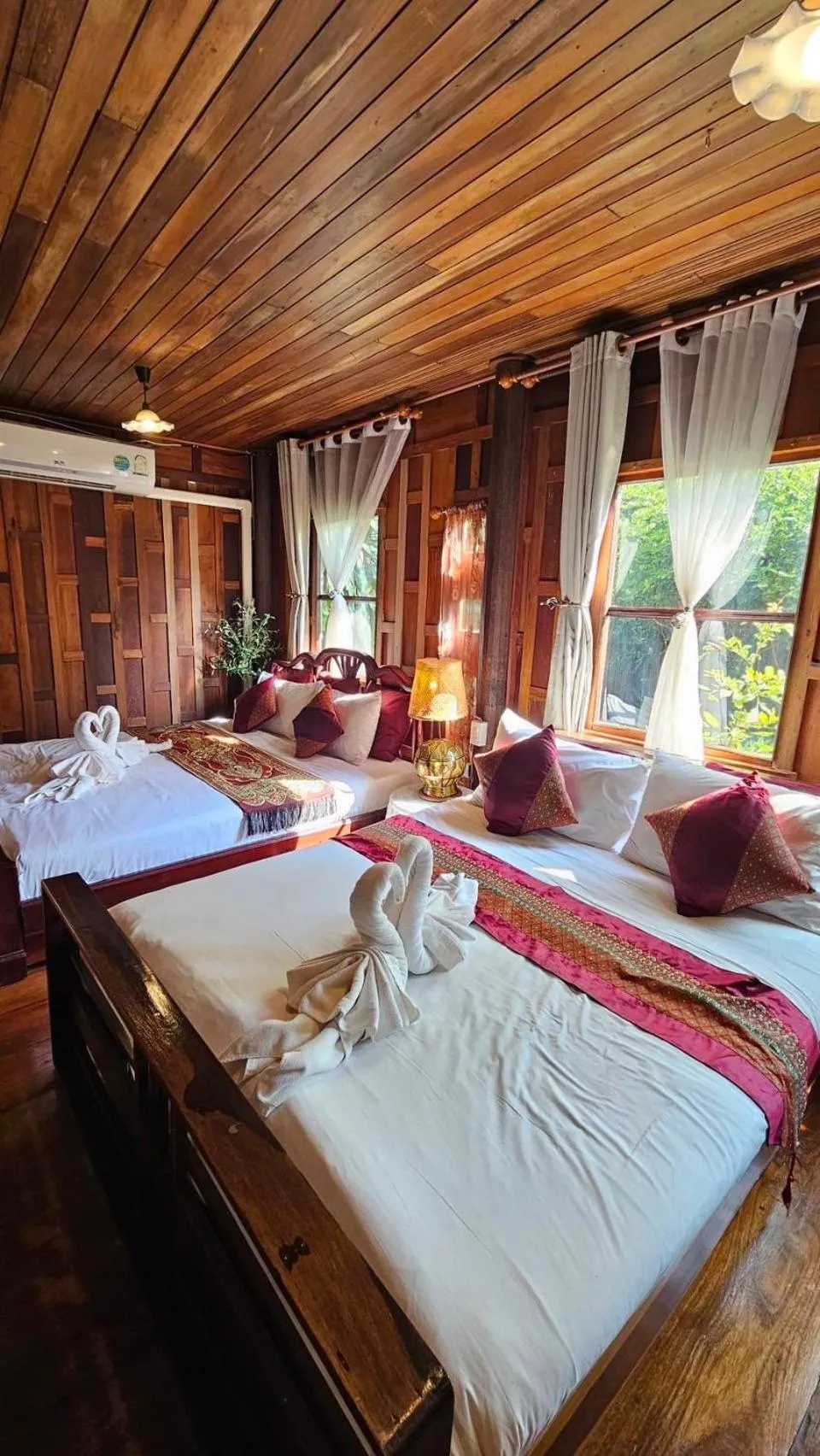 Bed in The Antique Riverside Resort