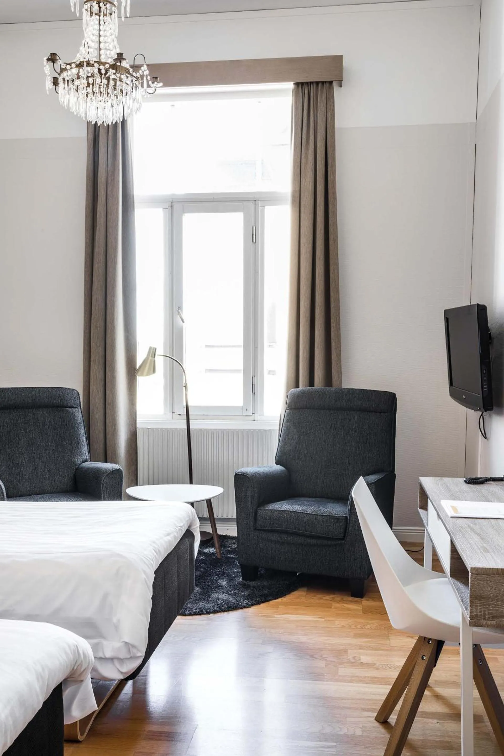 Photo of the whole room, Bed in Piteå Stadshotell