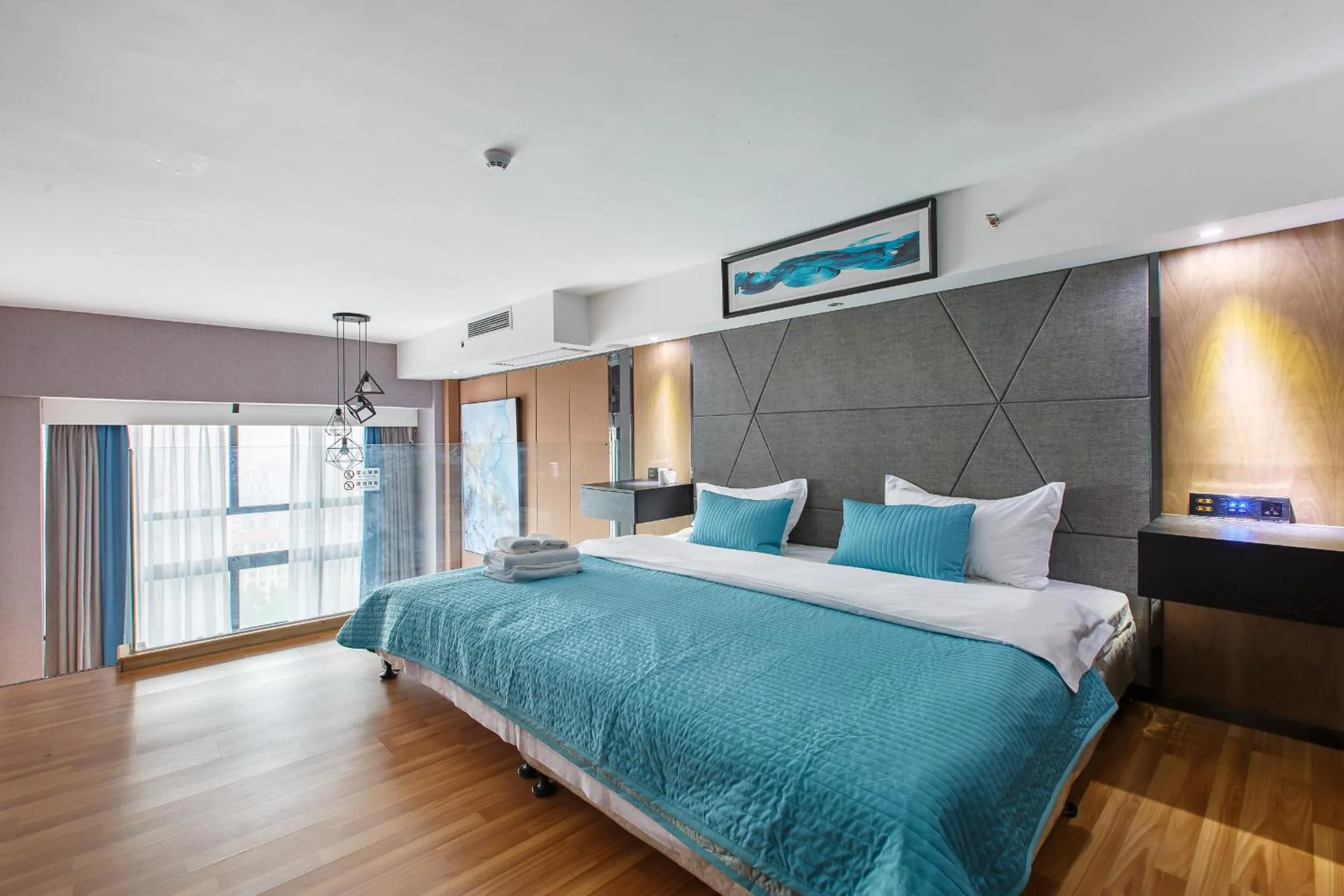 Bed in Lavender Apartment Branch