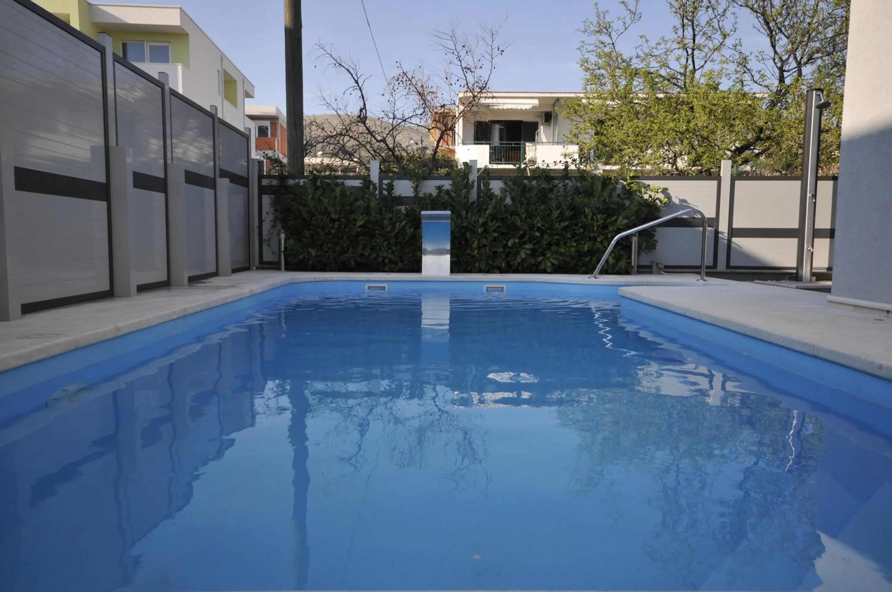 Swimming pool in Apartments & Rooms Villa Maslina