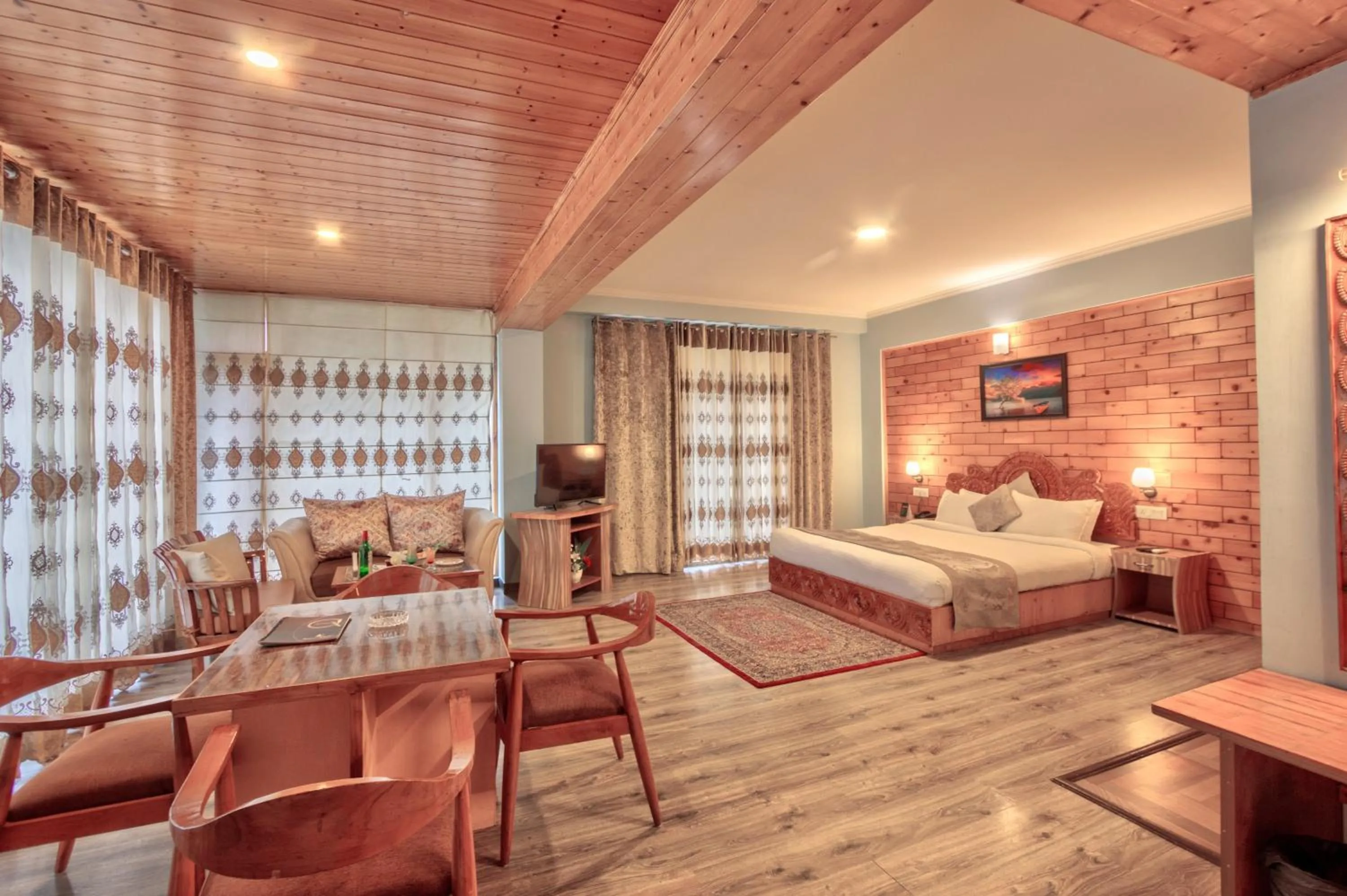 Seating area, Bed in Snow Flakes Resort And Spa Centrally Heated Luxury Resort