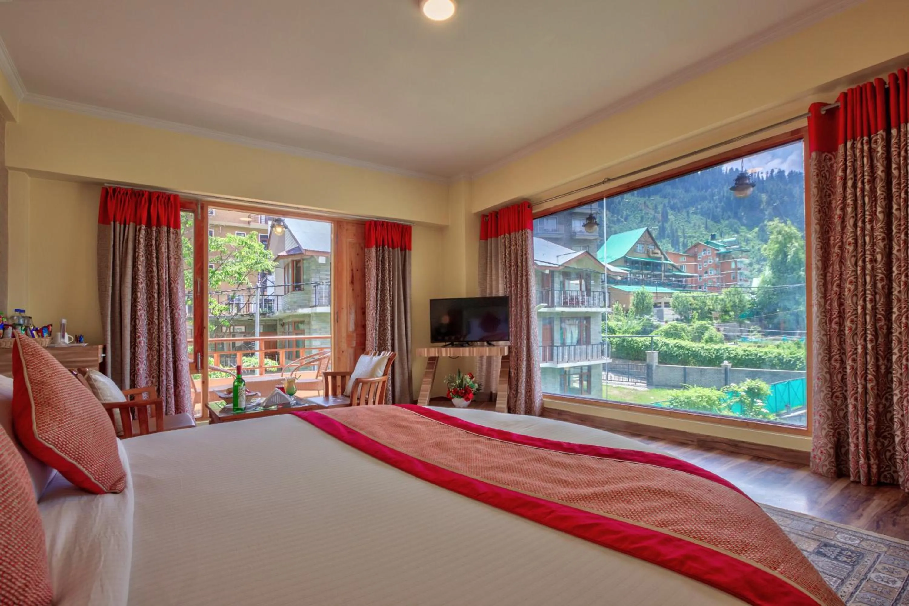 Bed in Snow Flakes Resort And Spa Centrally Heated Luxury Resort