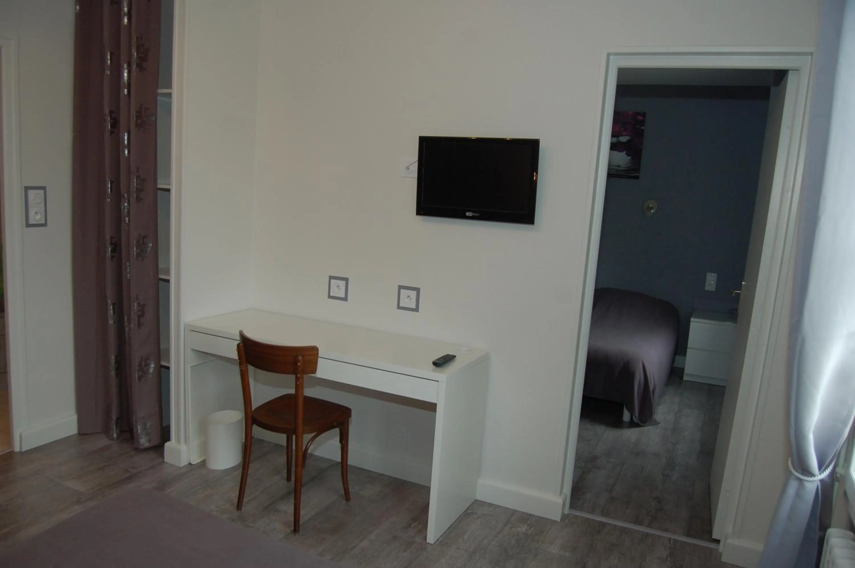 Bedroom in Le Relais des Primeurs LOGIS HOTEL