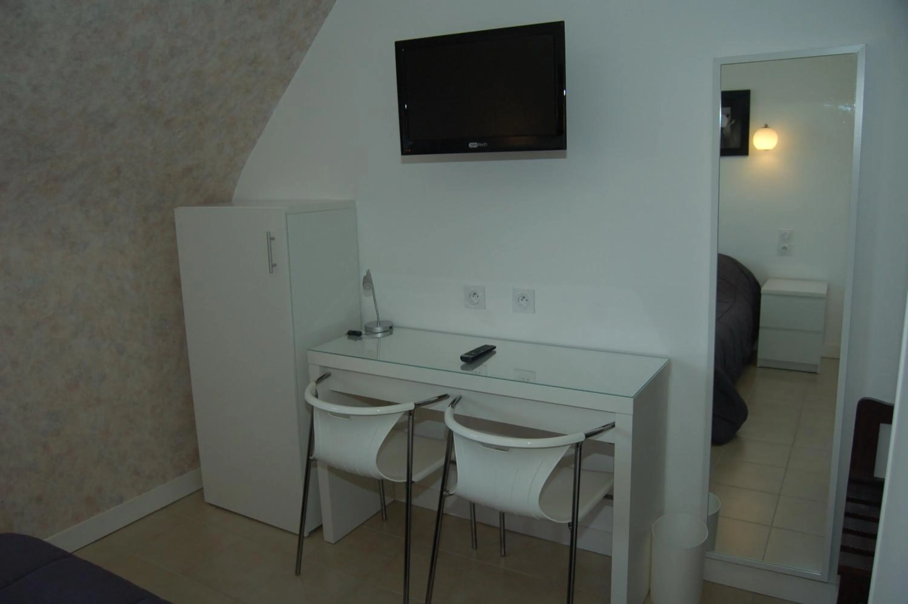 Bedroom in Le Relais des Primeurs LOGIS HOTEL