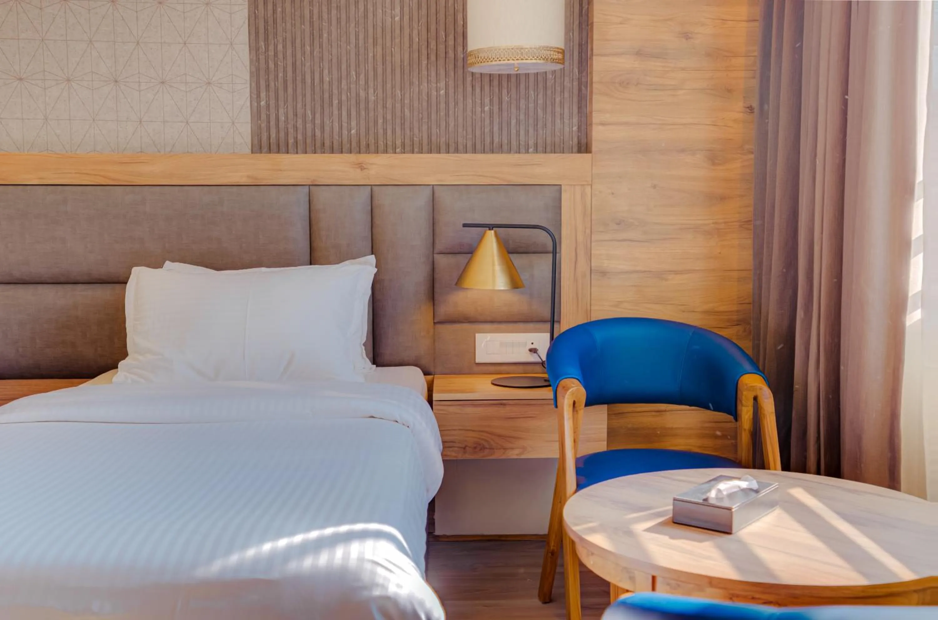 Bed in Hotel Vasundhara Palace