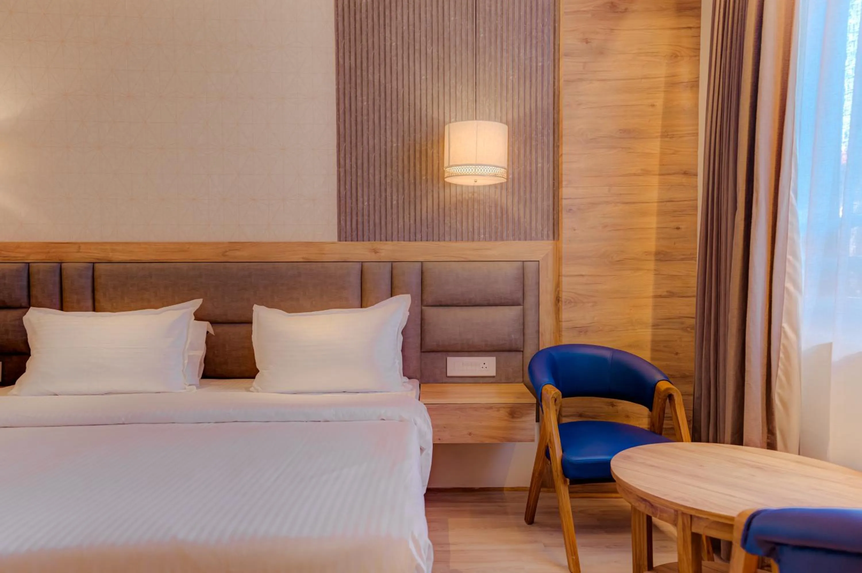 Bed in Hotel Vasundhara Palace