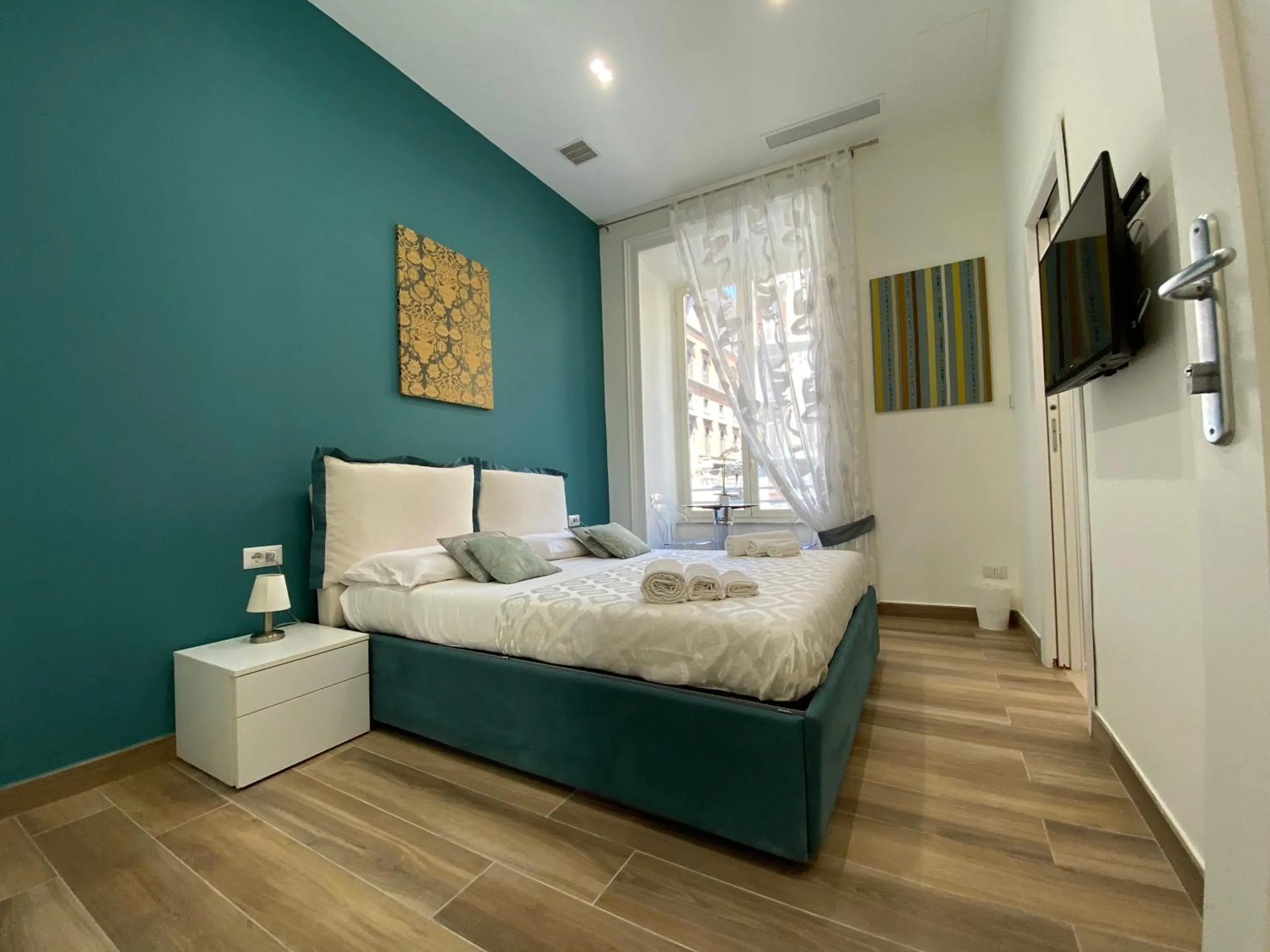 Bed in Sun Art Naples Rooms