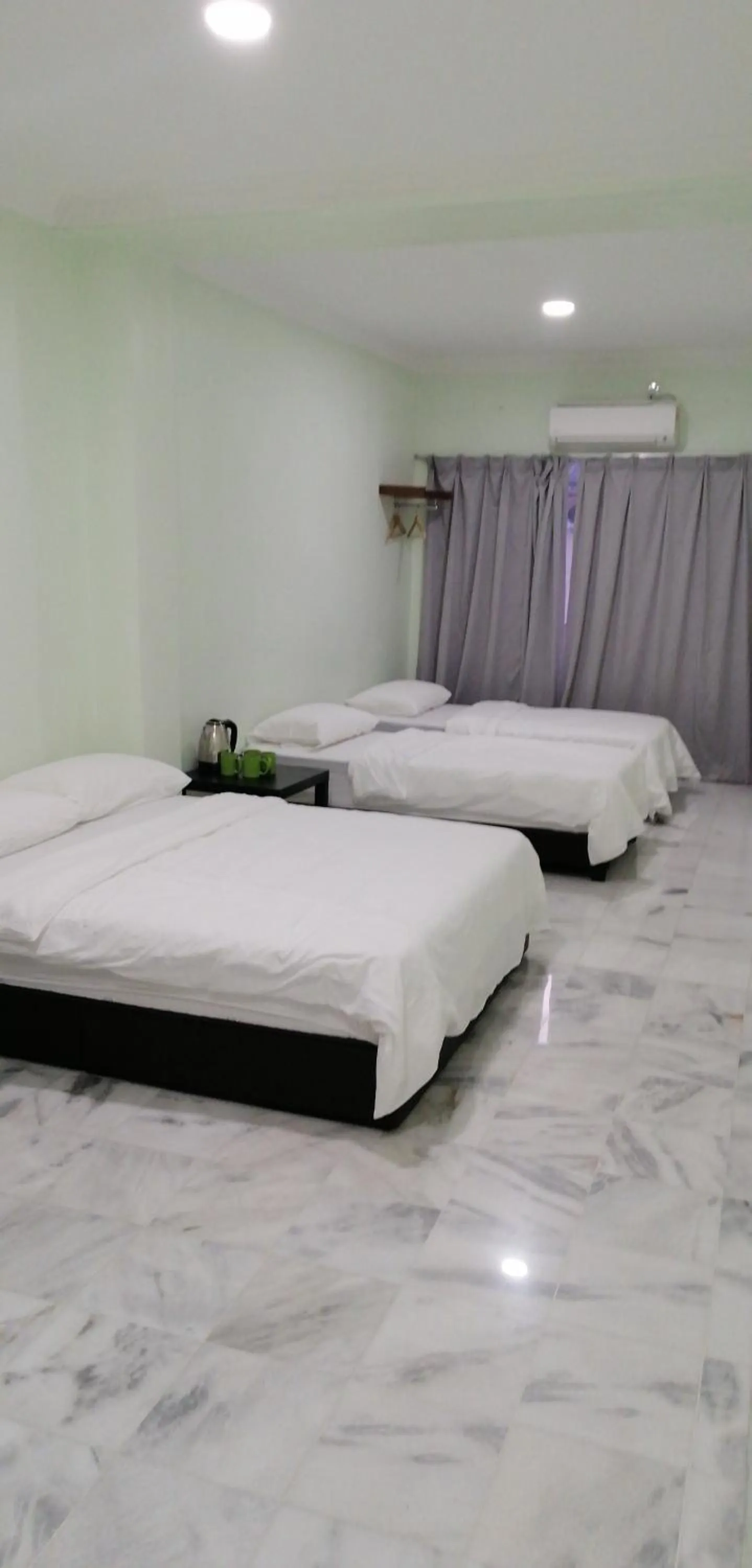 Bed in JS Guest House Air Putih