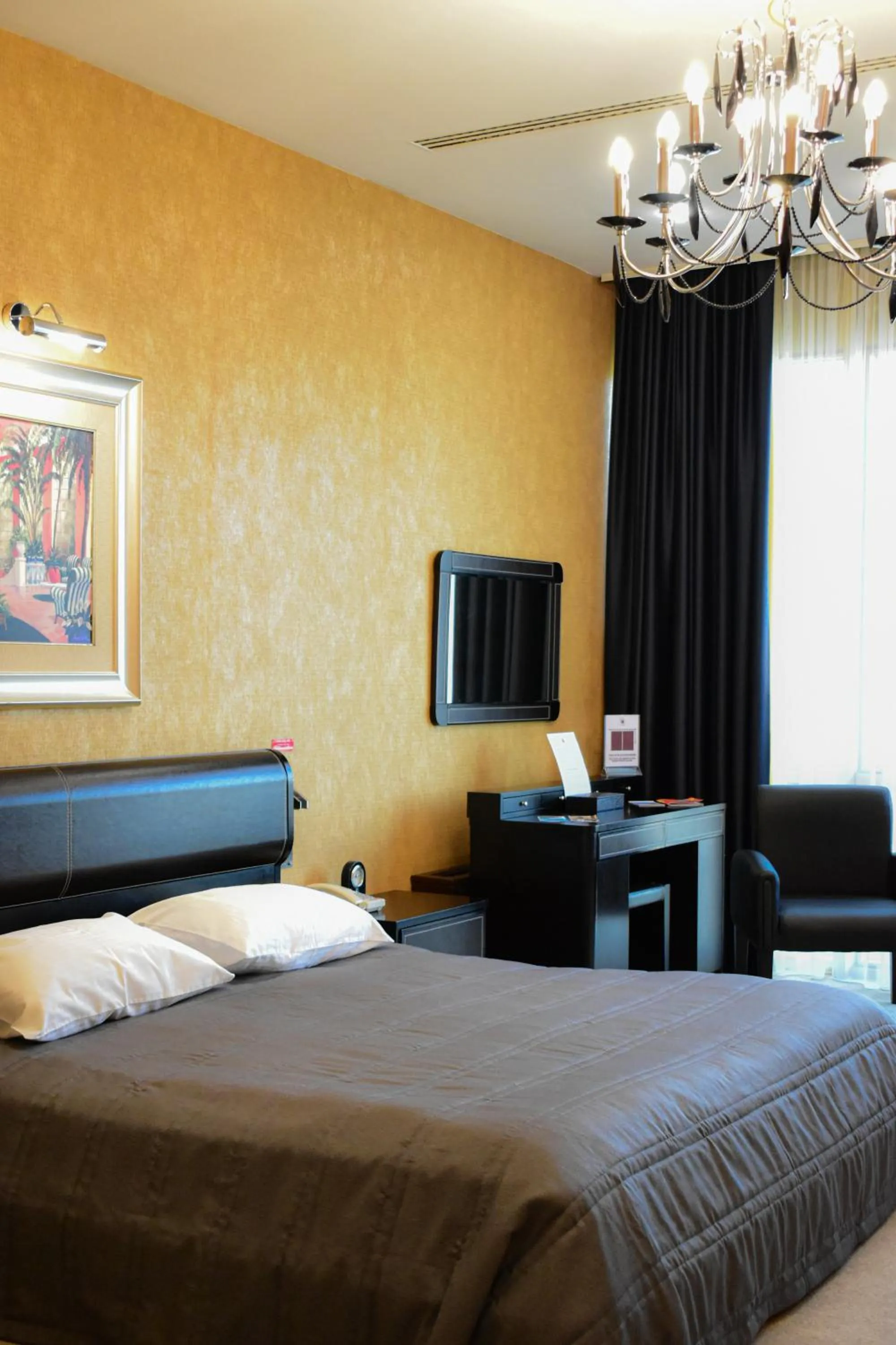 Communal lounge/ TV room, Bed in Hotel Feride