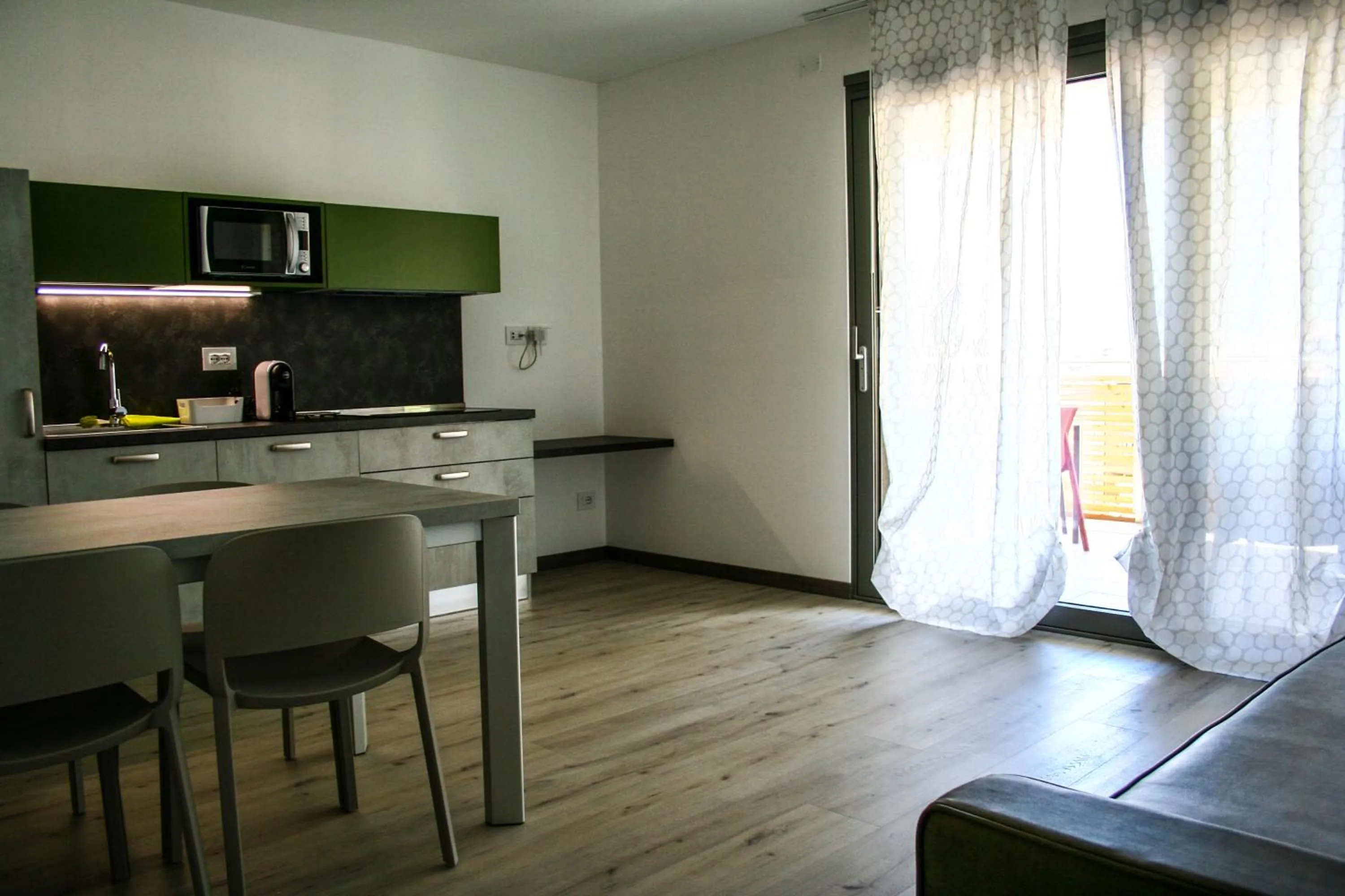Kitchen or kitchenette in GardaBreak Rooms&Breakfast Holiday Apartments