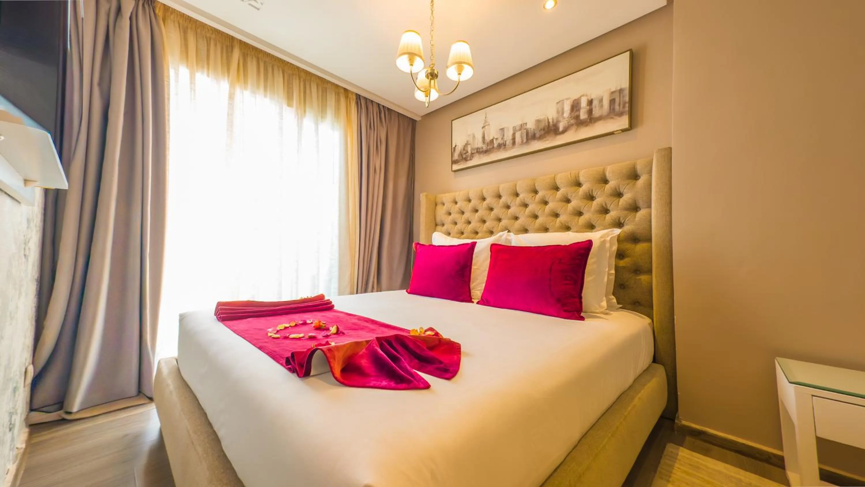 Bed in RENT-INN Suites Hotel