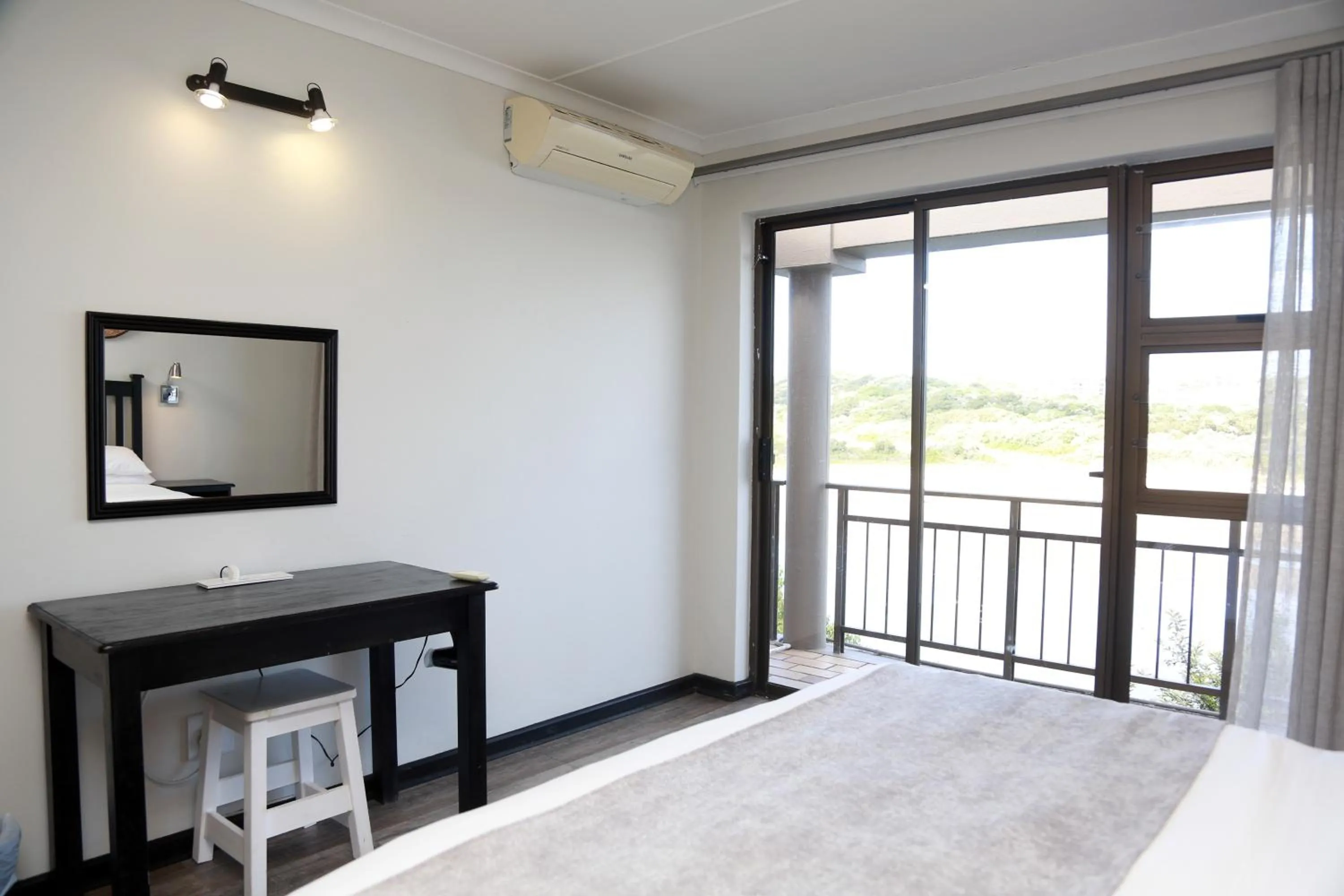 Seating area, Bed in Blue Lagoon Hotel and Conference Centre