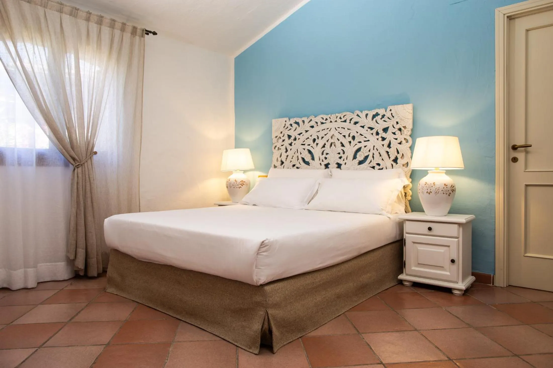 Bed in La Jacia Hotel & Resort