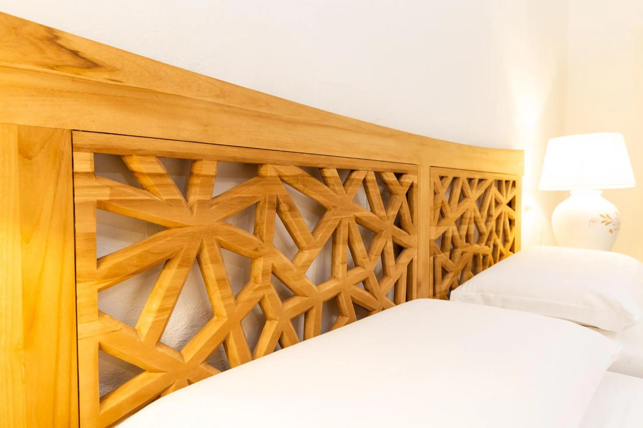 Bed in La Jacia Hotel & Resort